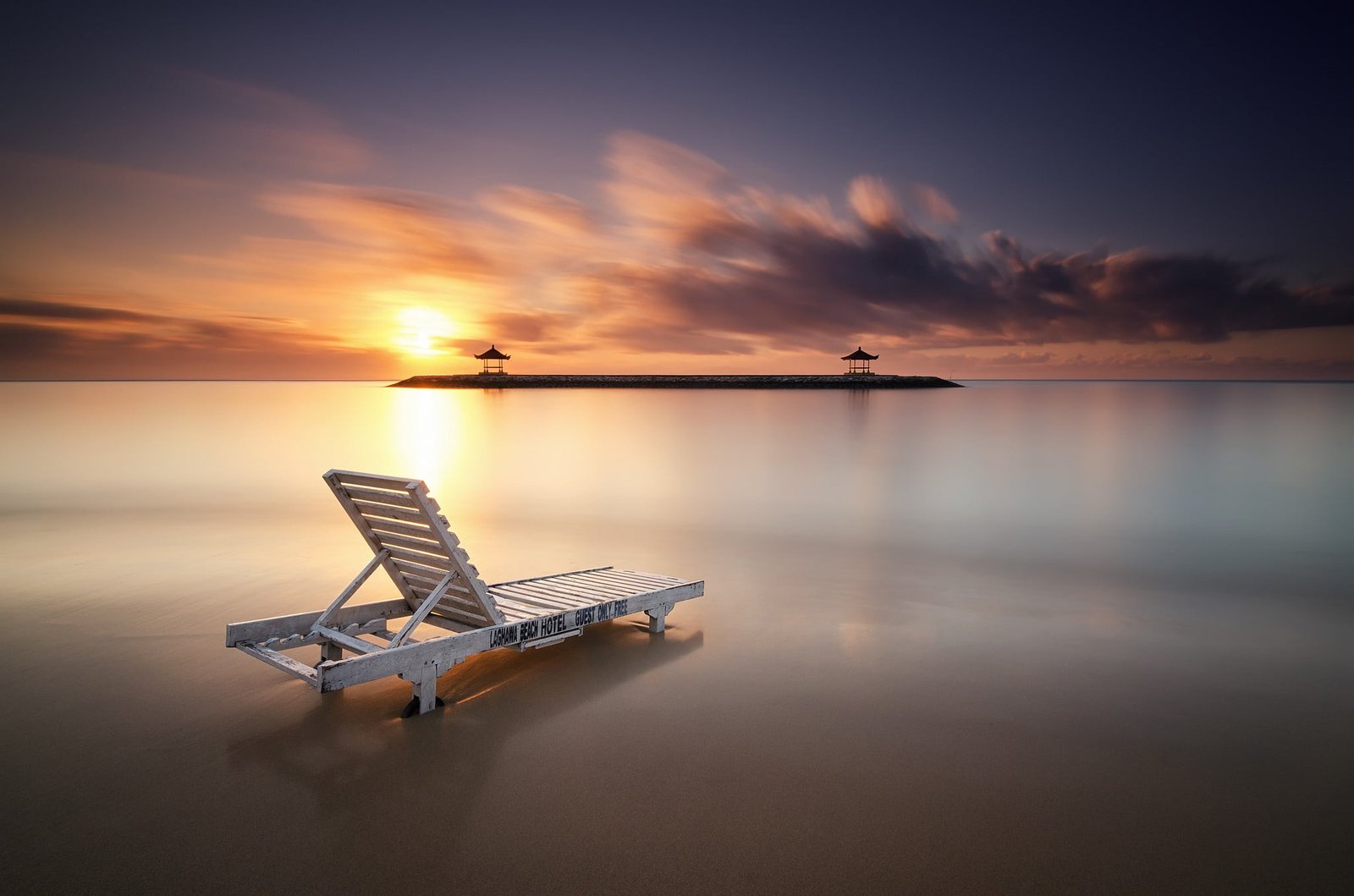 white wooden lounge chair Indonesia beach Bali village landscape 2k
