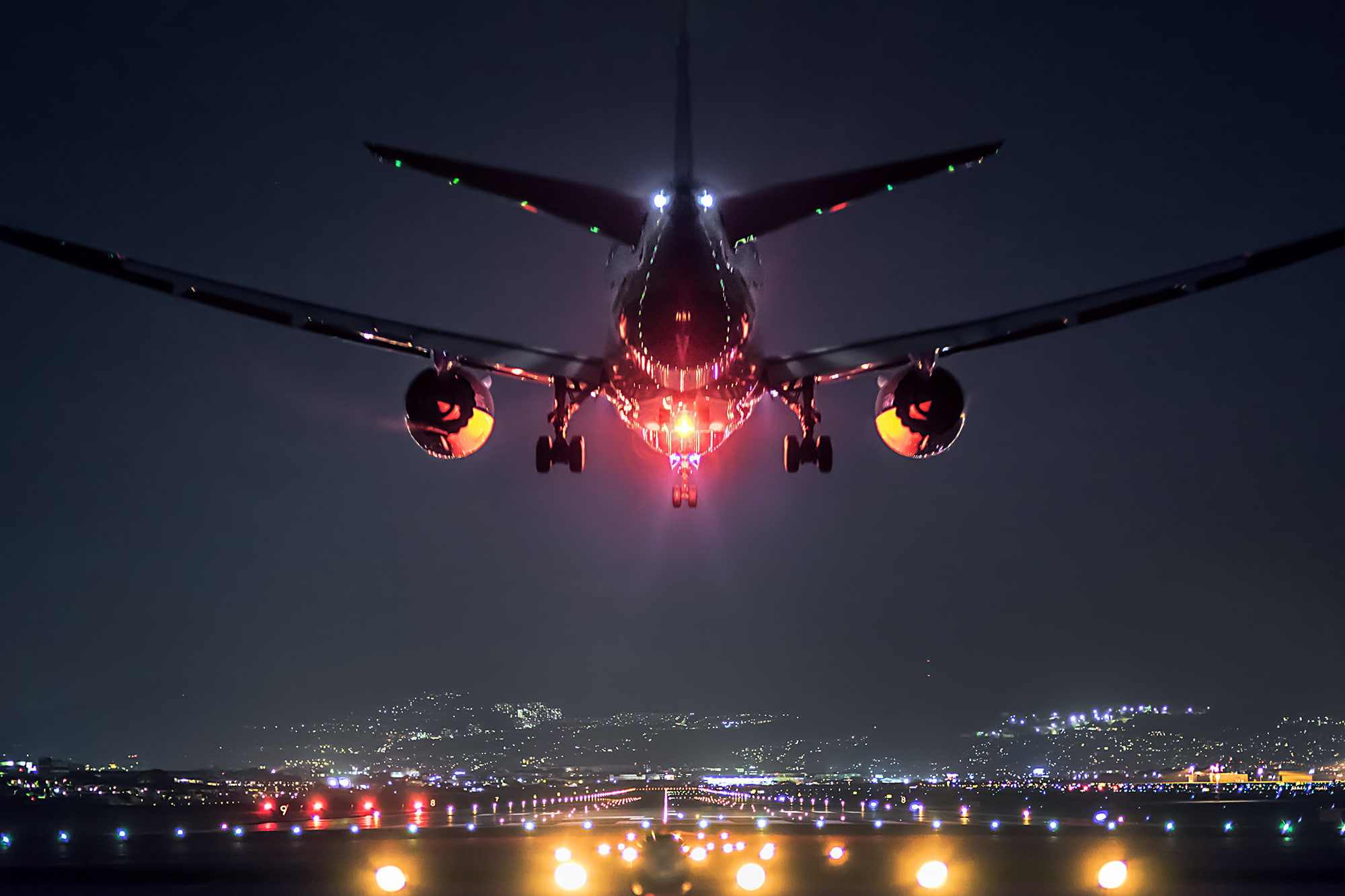 black airliner landscape lights the plane Japan airport 2k