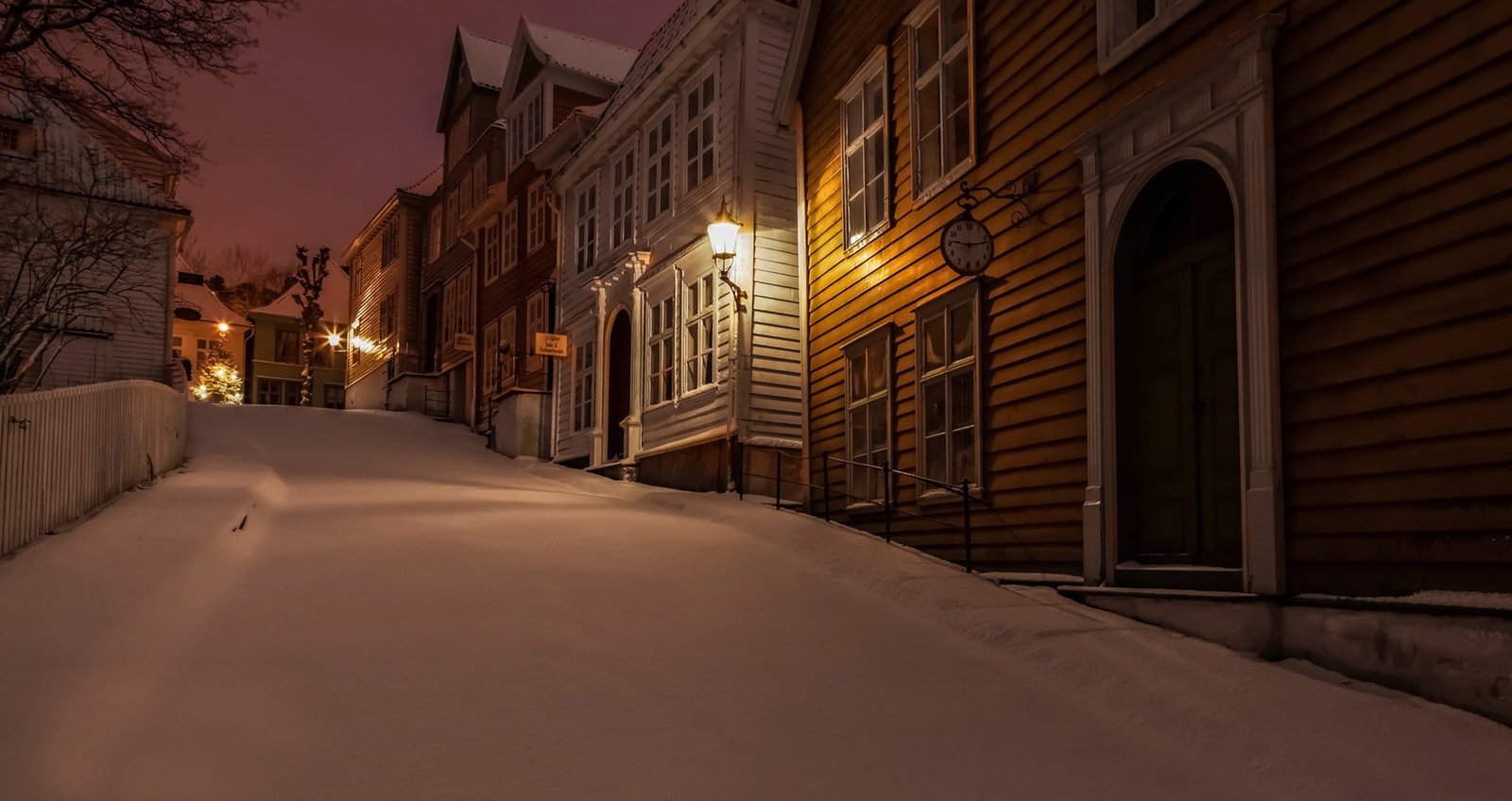 yellow wooden house nature winter snow Norway town night 2k