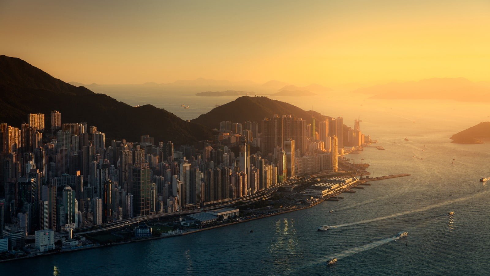 white high rise buildings aerial view photography of city near mountain 2k
