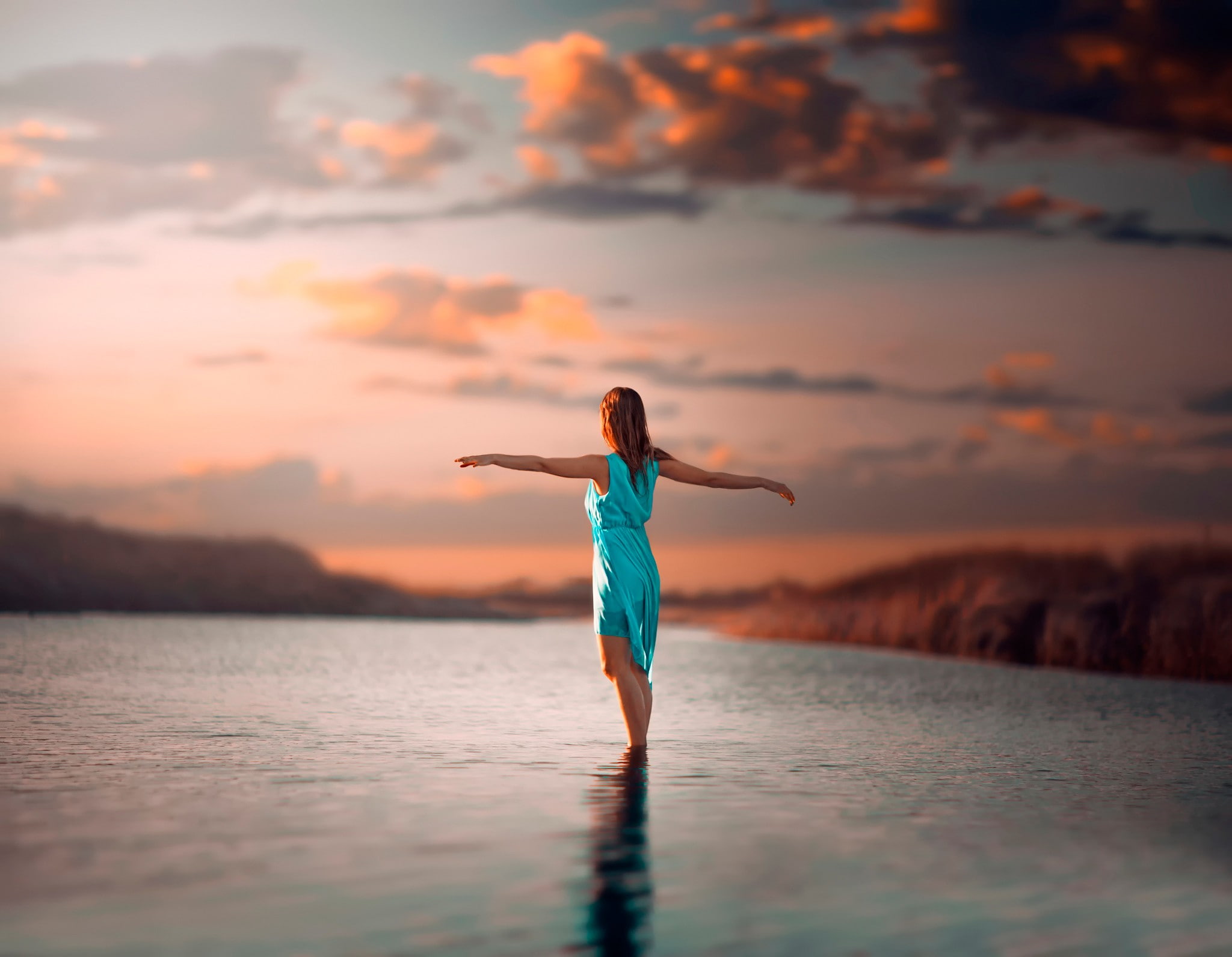 women on beach blue dress redhead in water wet clothing 2k