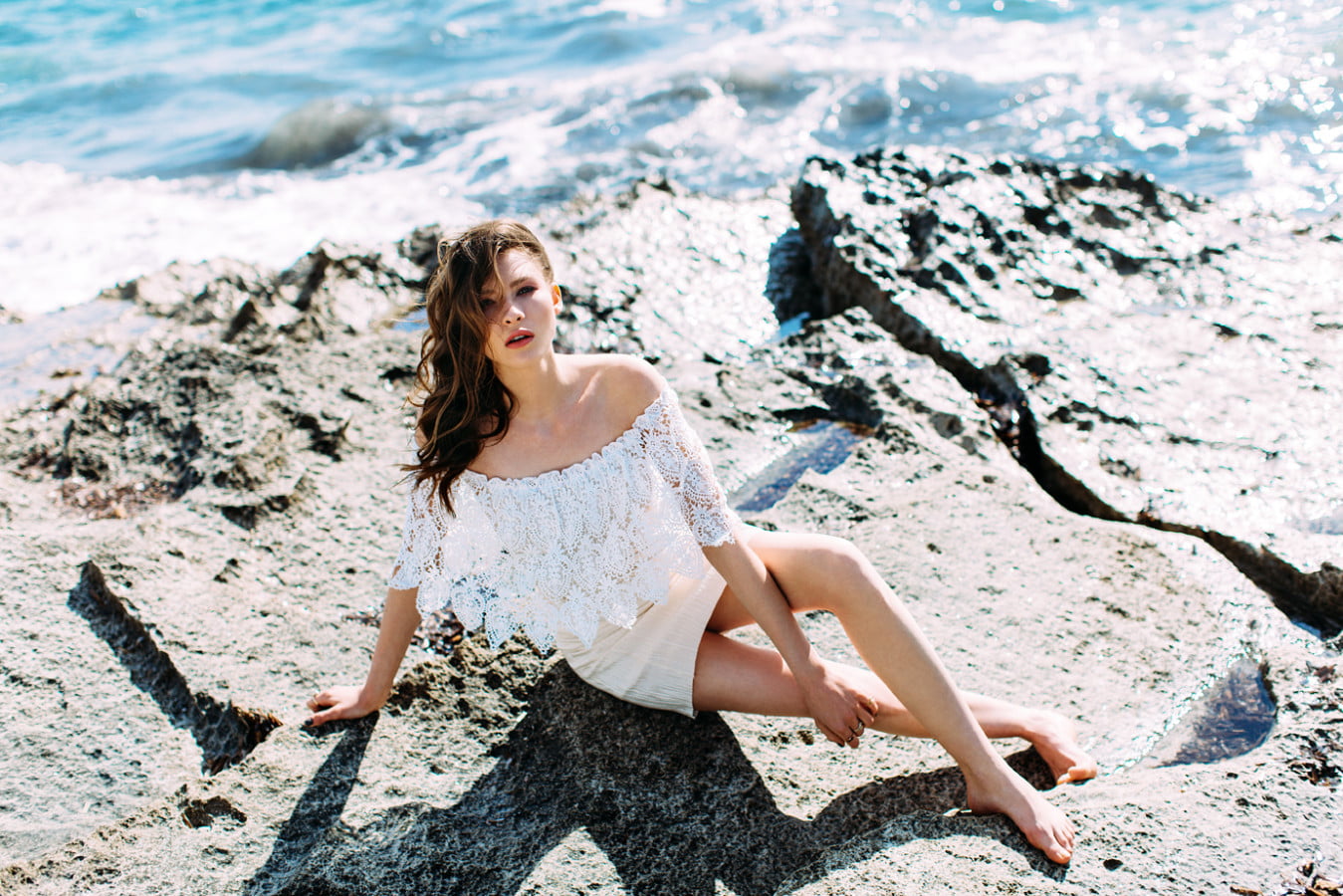 model women beach looking at viewer white dress barefoot
