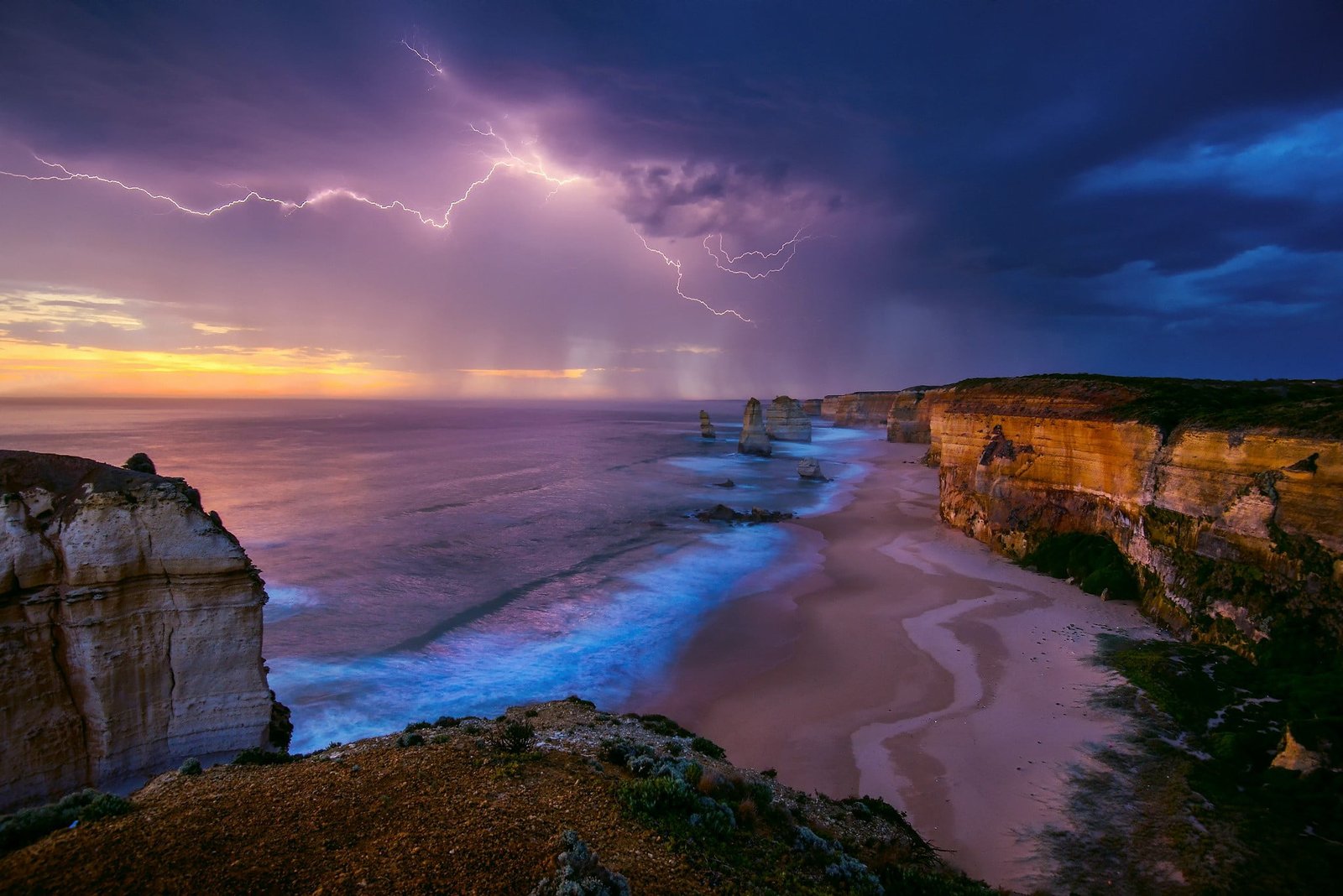 beach shore lightning and clouds during sunset nature landscape 2k
