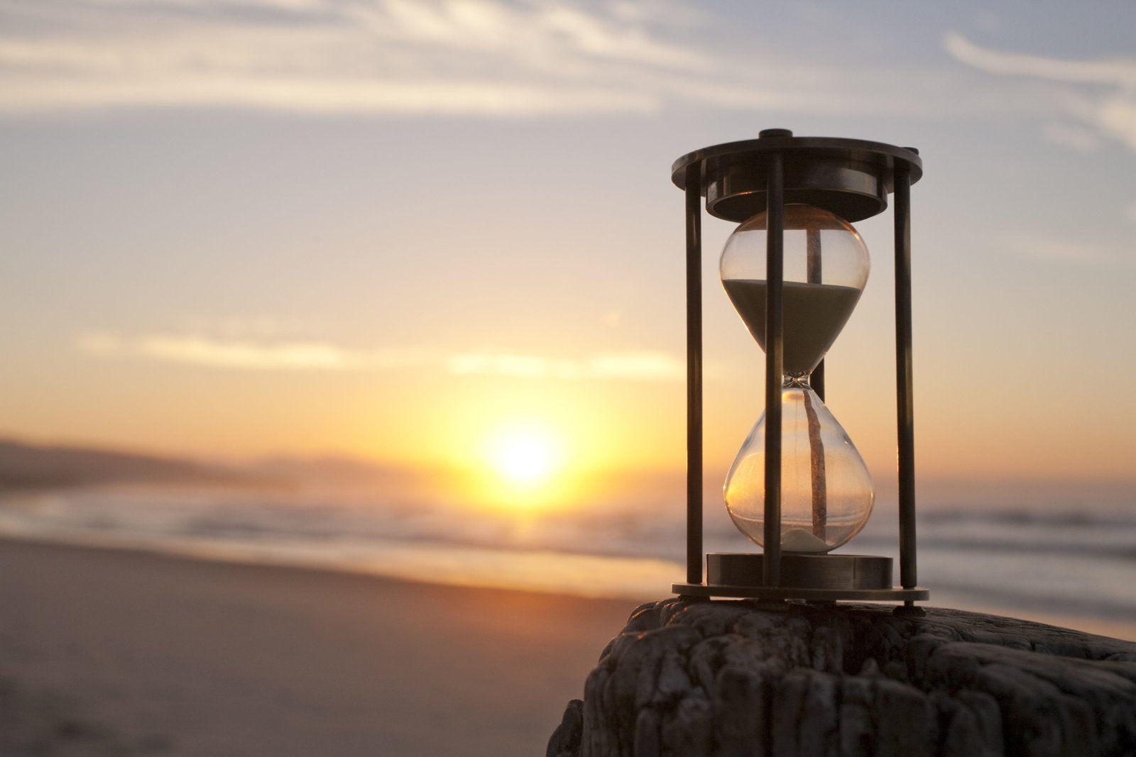 hourglass sand sea wave beach the sky water sun clouds 2k 4k