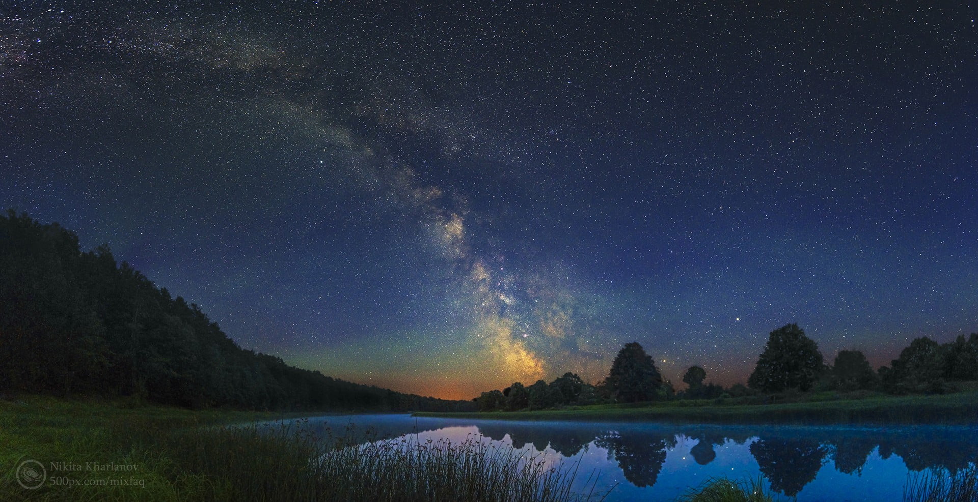 landscape photography of mountains against nebula night sky 2k
