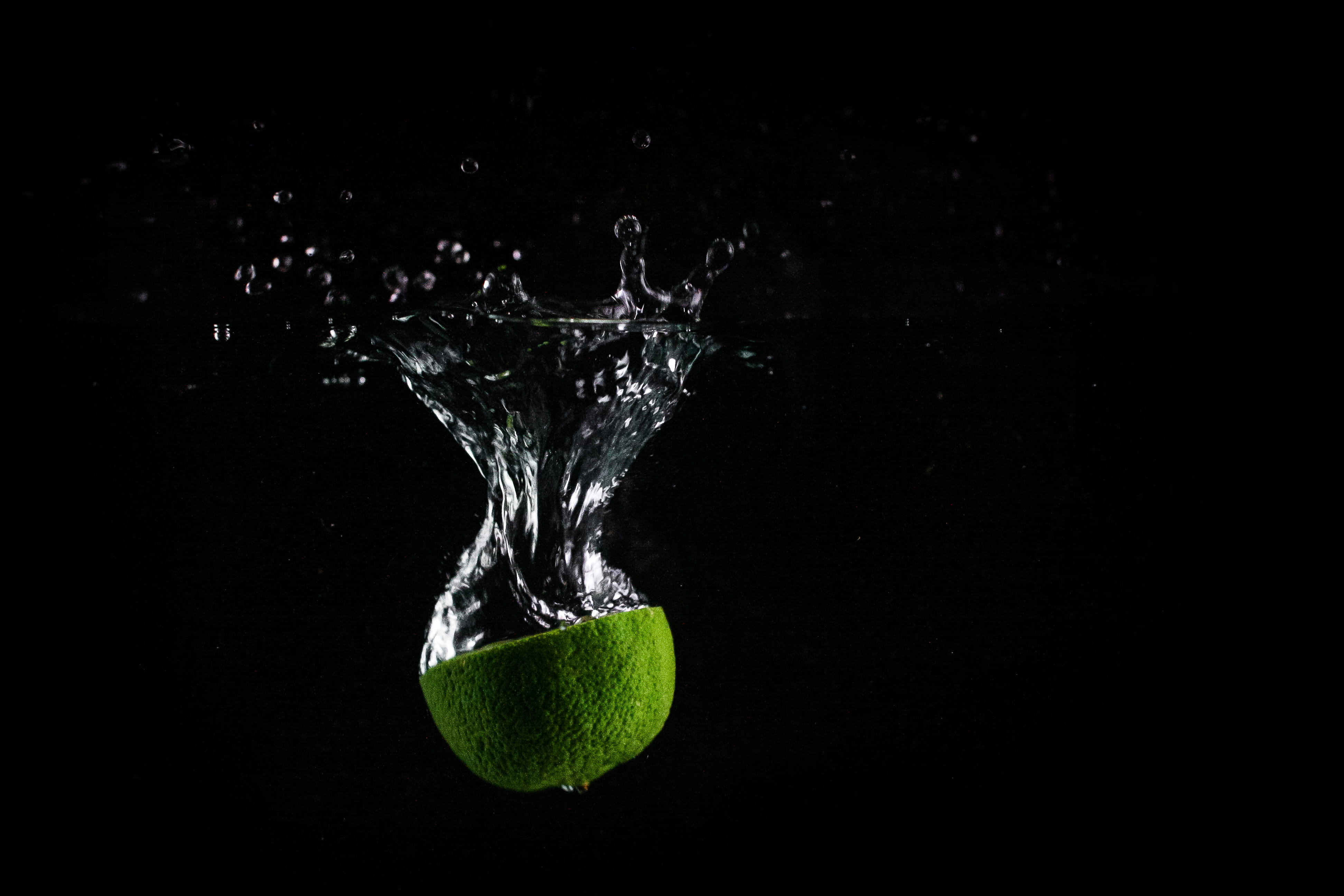 Lime In Water with Black Background fresh fruit healthy splashing 2k 4k