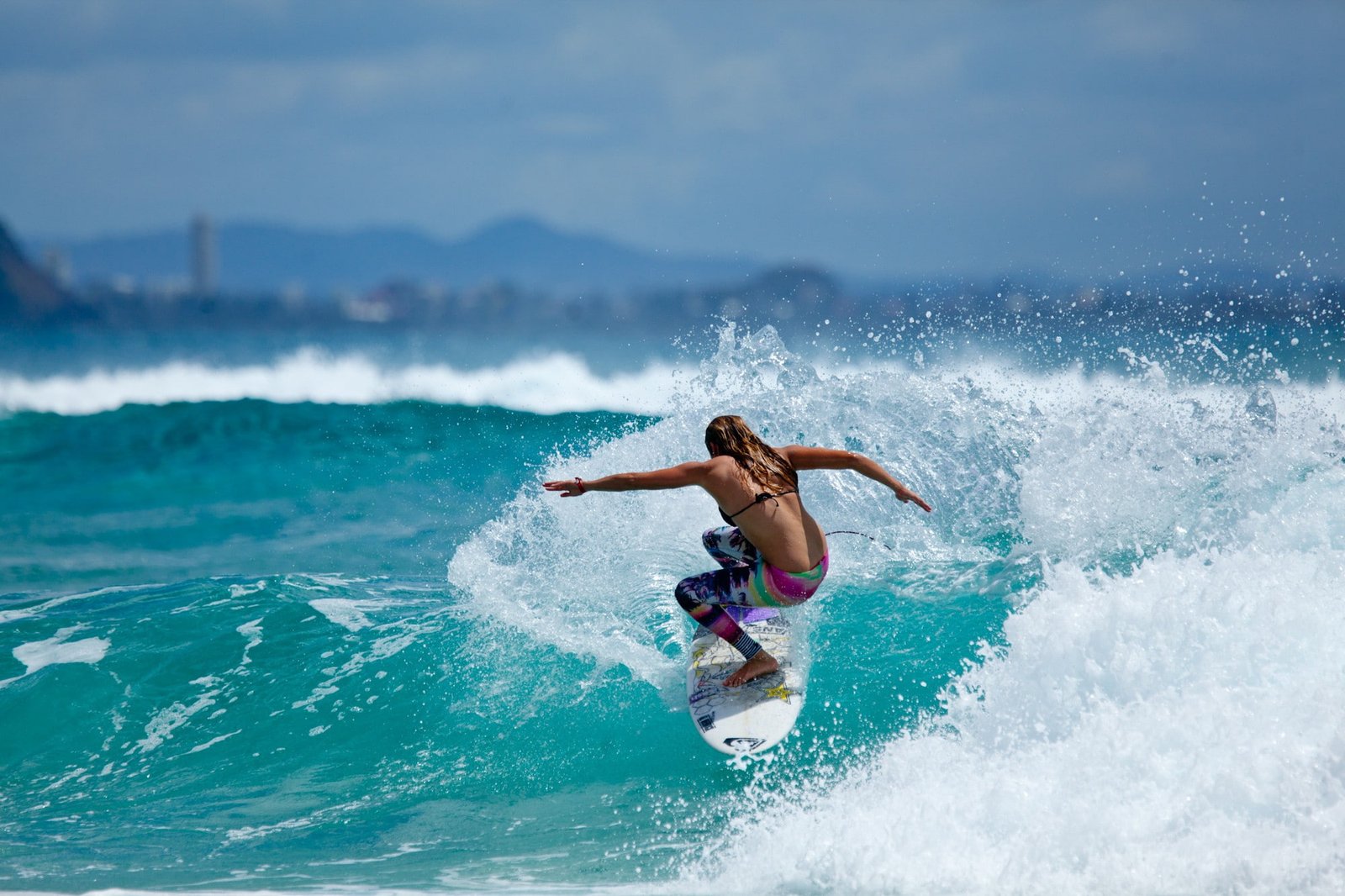 sports women on beach surfers back brunette 2k