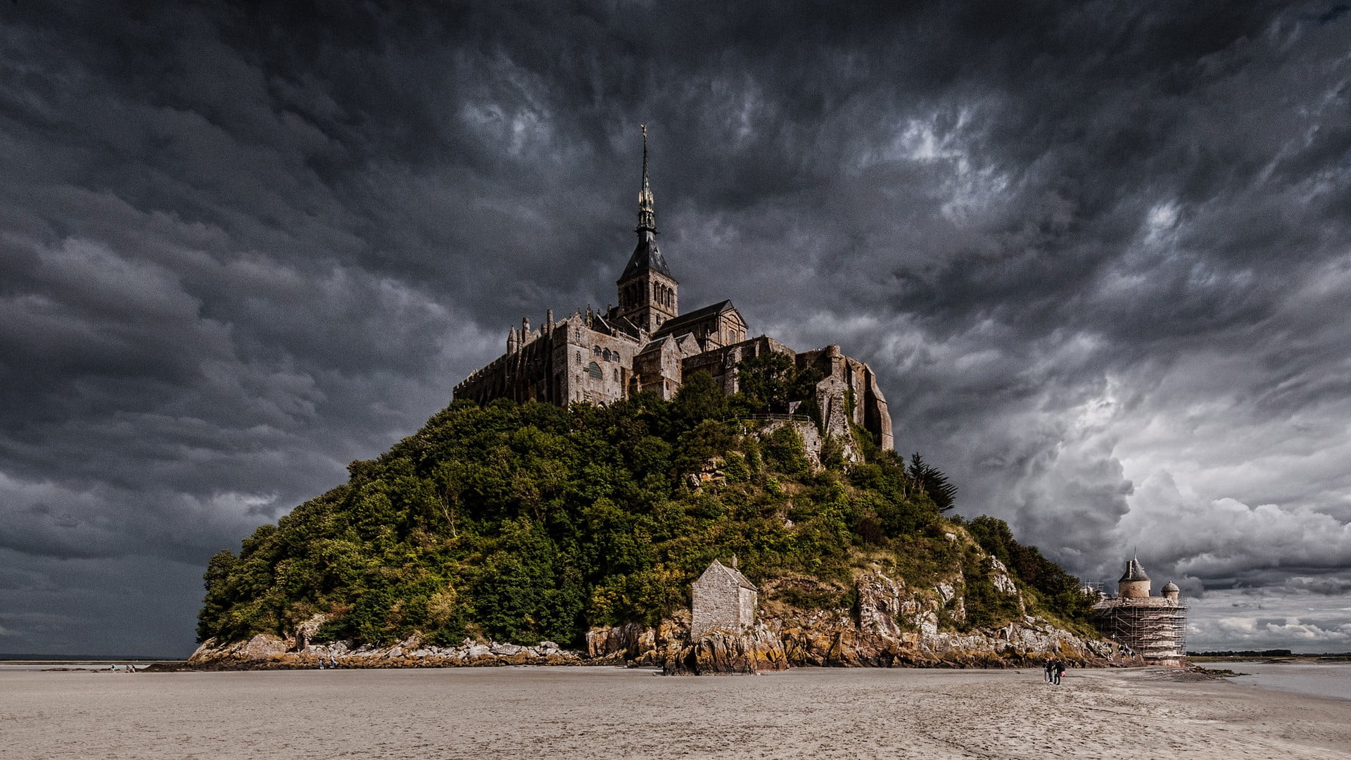 brown concrete castle on hill nature island beach Mont Saint Michel 2k