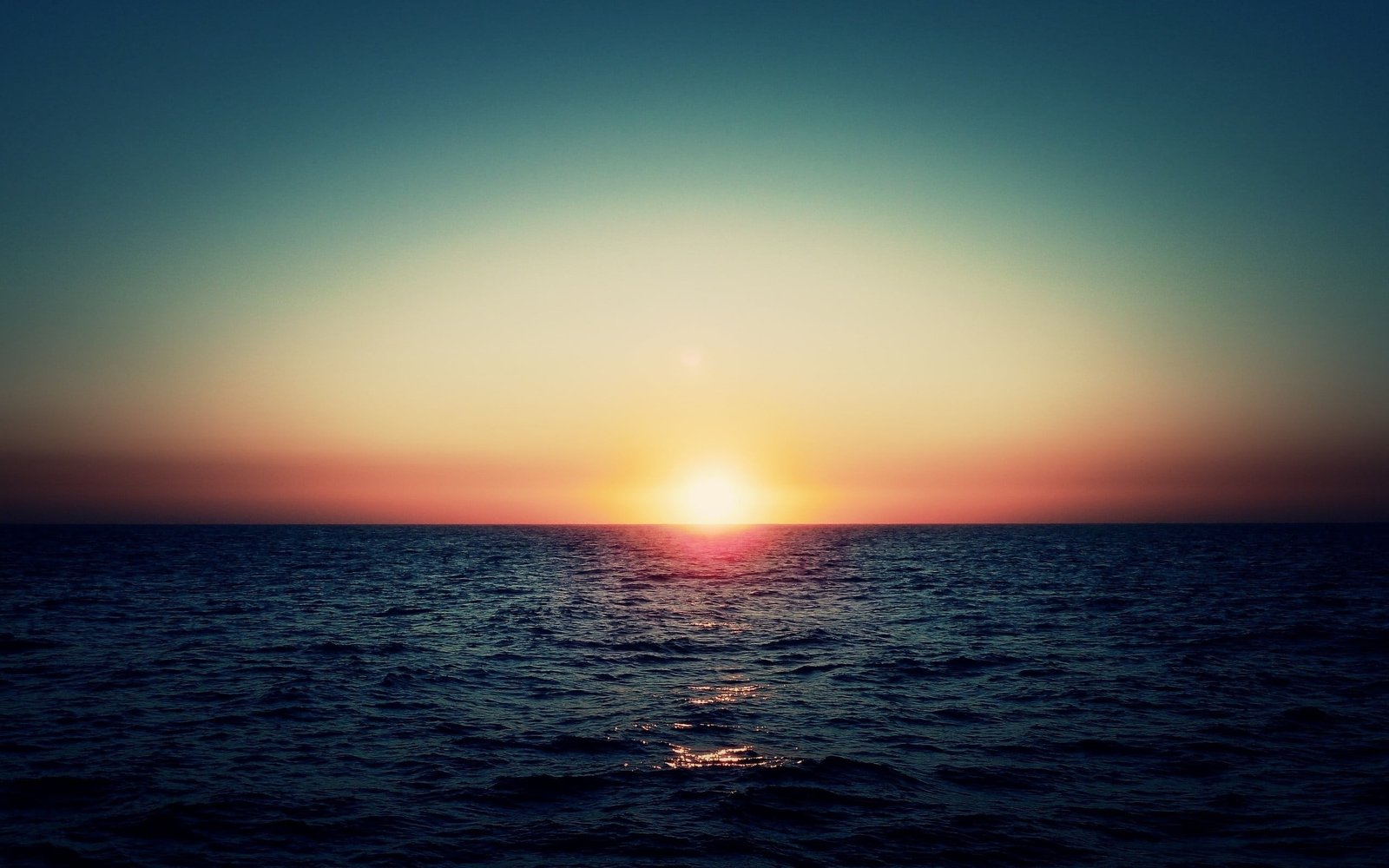 calm body of water sunset sea sunlight sky nature summer 2k