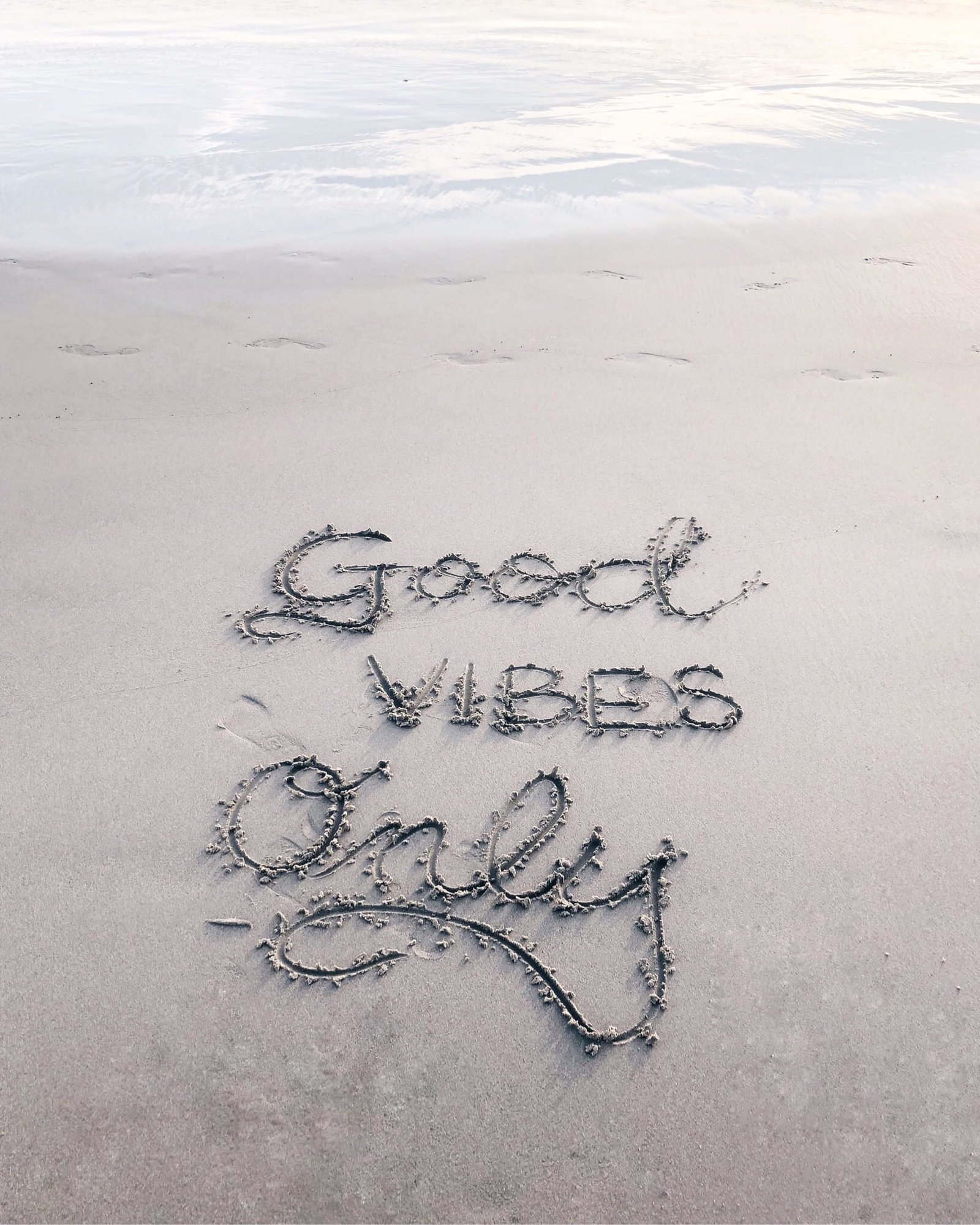 Good Vibes Only sand text good vibes only written on the 2k