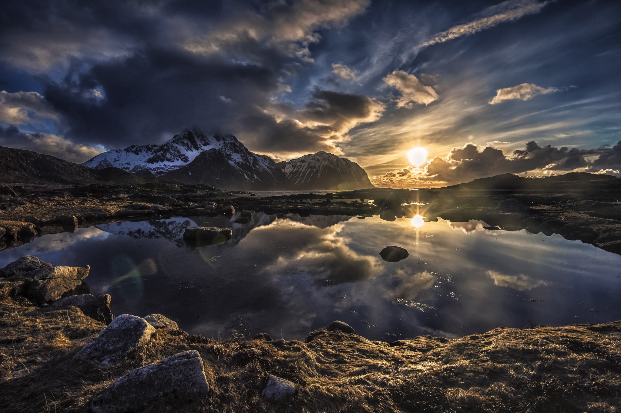 small body of water Lofoten Norway sunset mountains clouds 2k