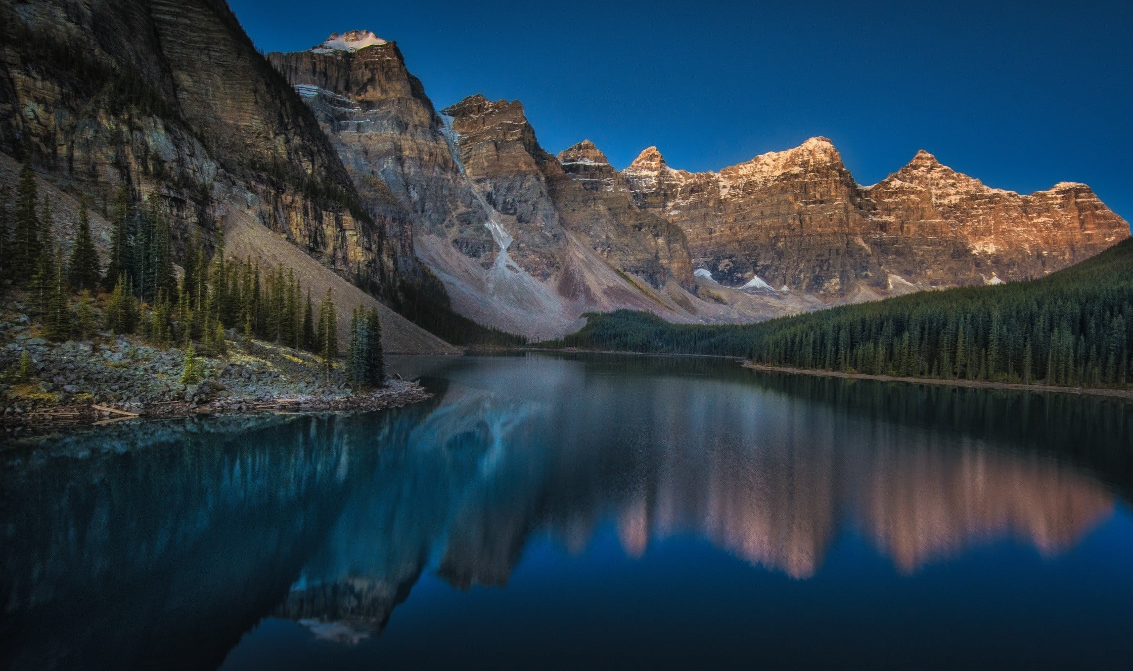 body of water near trees mountains Moraine Lake Canada sunset 2k