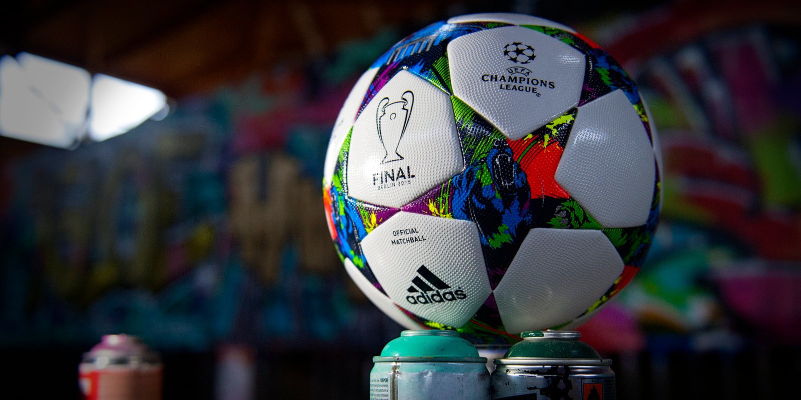 white and multicolored adidas soccer ball champions league 2k 4k