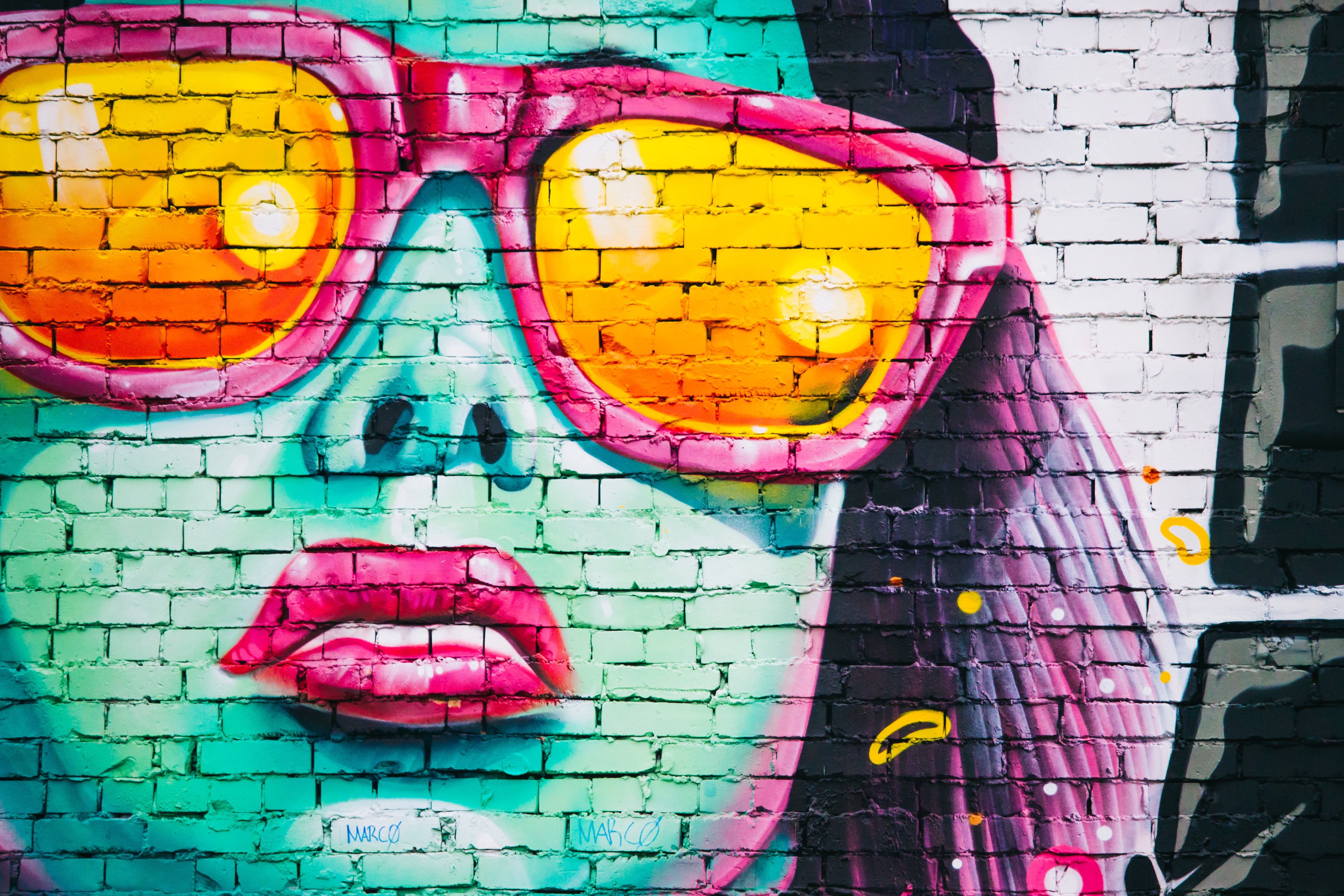 woman wearing sunglasses mural on brick wall photo pink painted 2k 4k 5k
