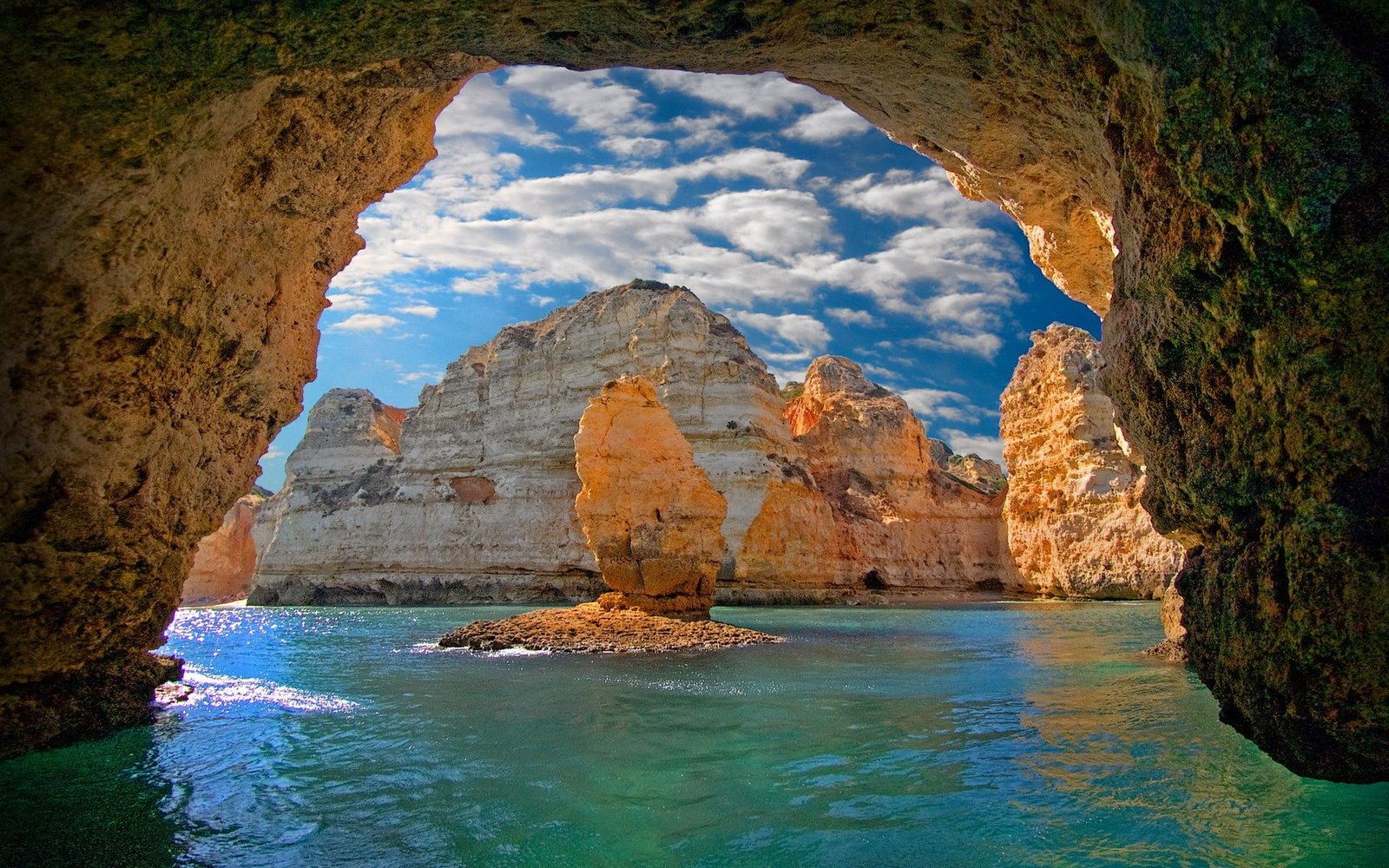 brown rock formation nature landscape cave sea island clouds 2k