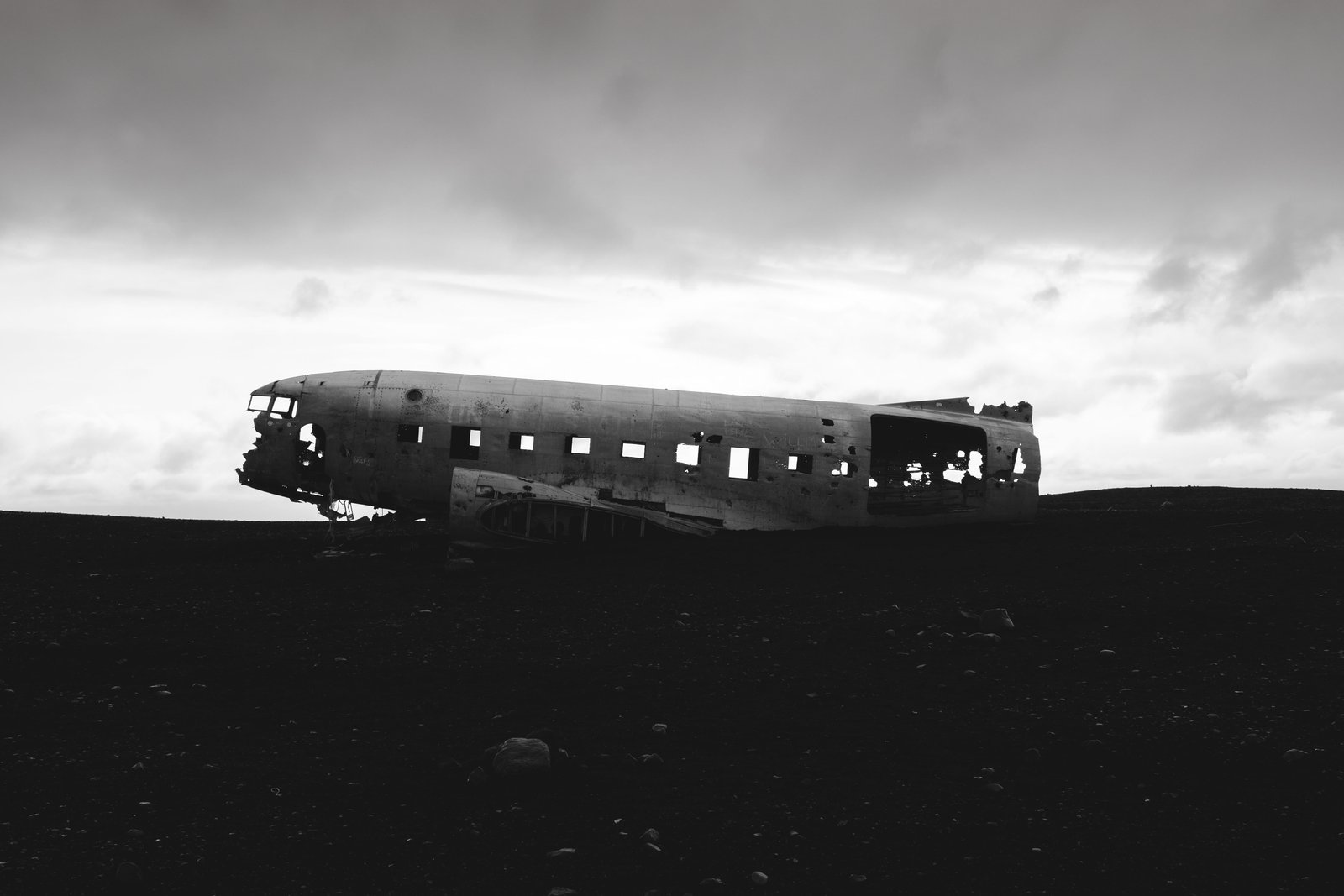 grayscale photography of wrecked plane iceland s lheimasandur 2k 4k 5k
