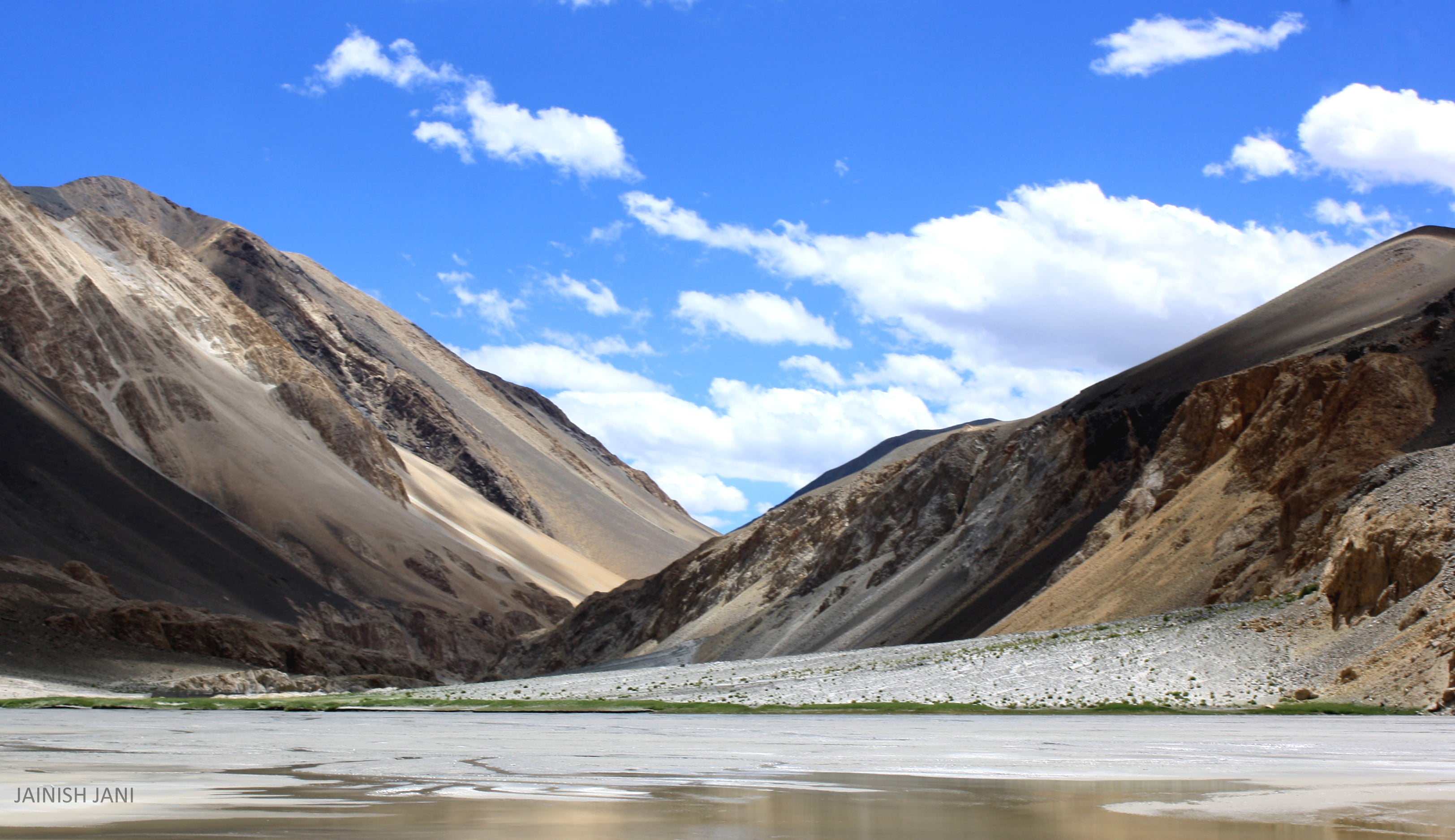 photography of white and brown mountain cloudy sky during daytime ladakh 2k
