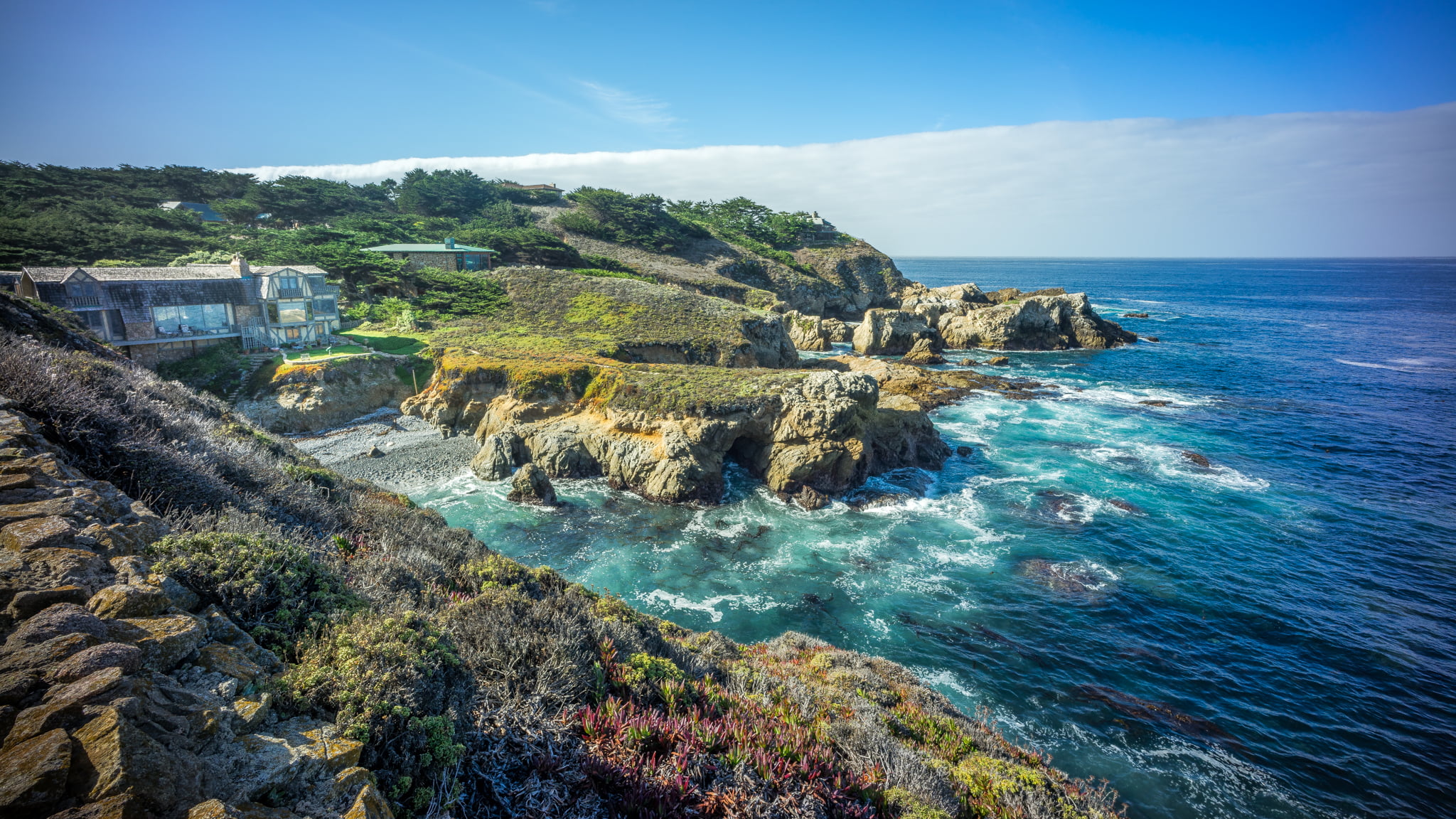 aerial photography of ocean and cliff under blue sky carmel california 2k