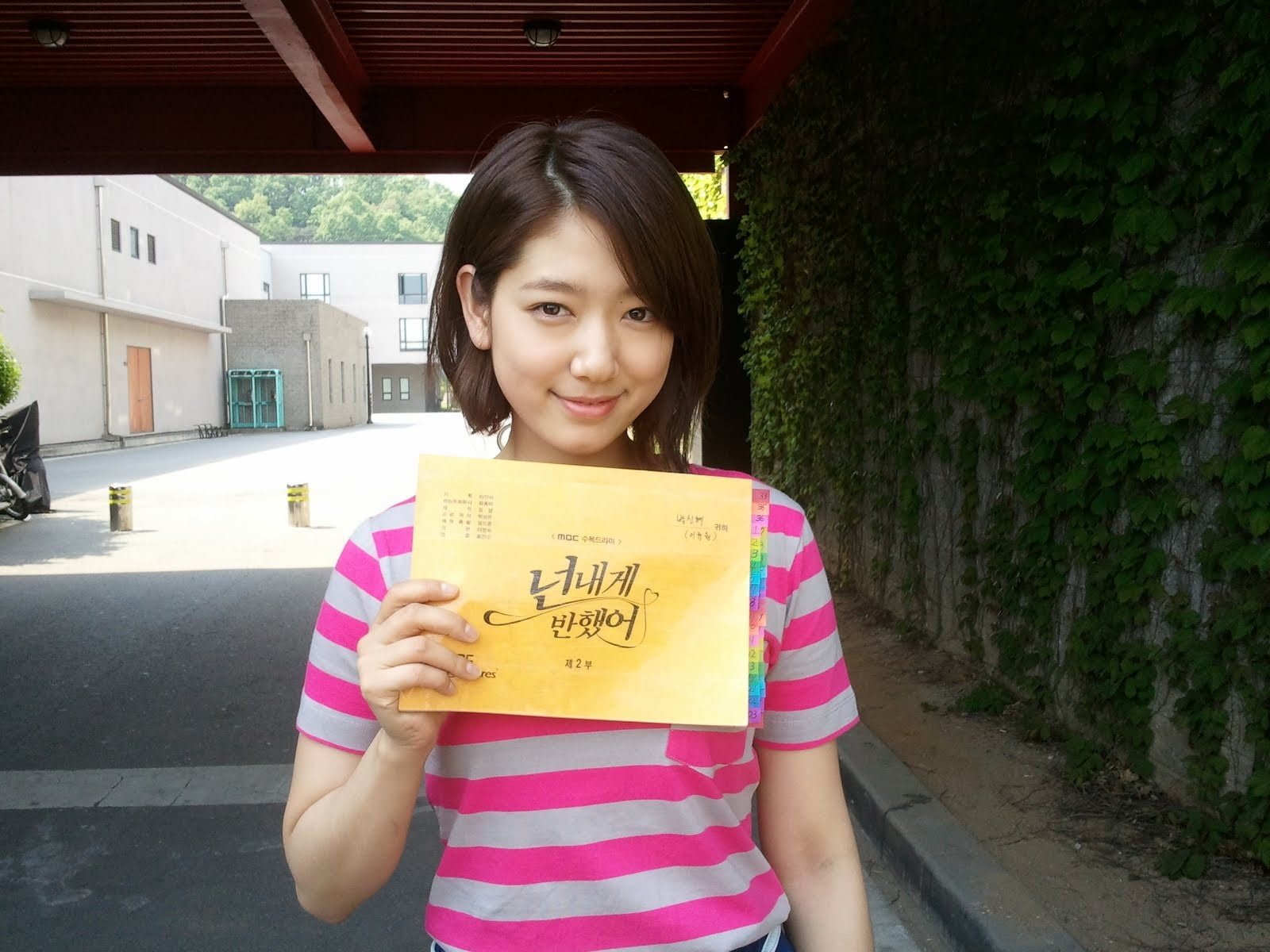 Asian women Korean portrait looking at camera holding 2k