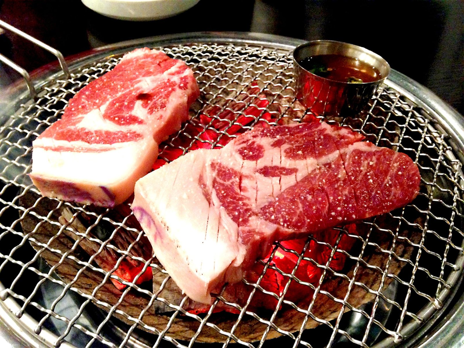 meat on grill in close up photography pork char grilled jeju black pig 2k