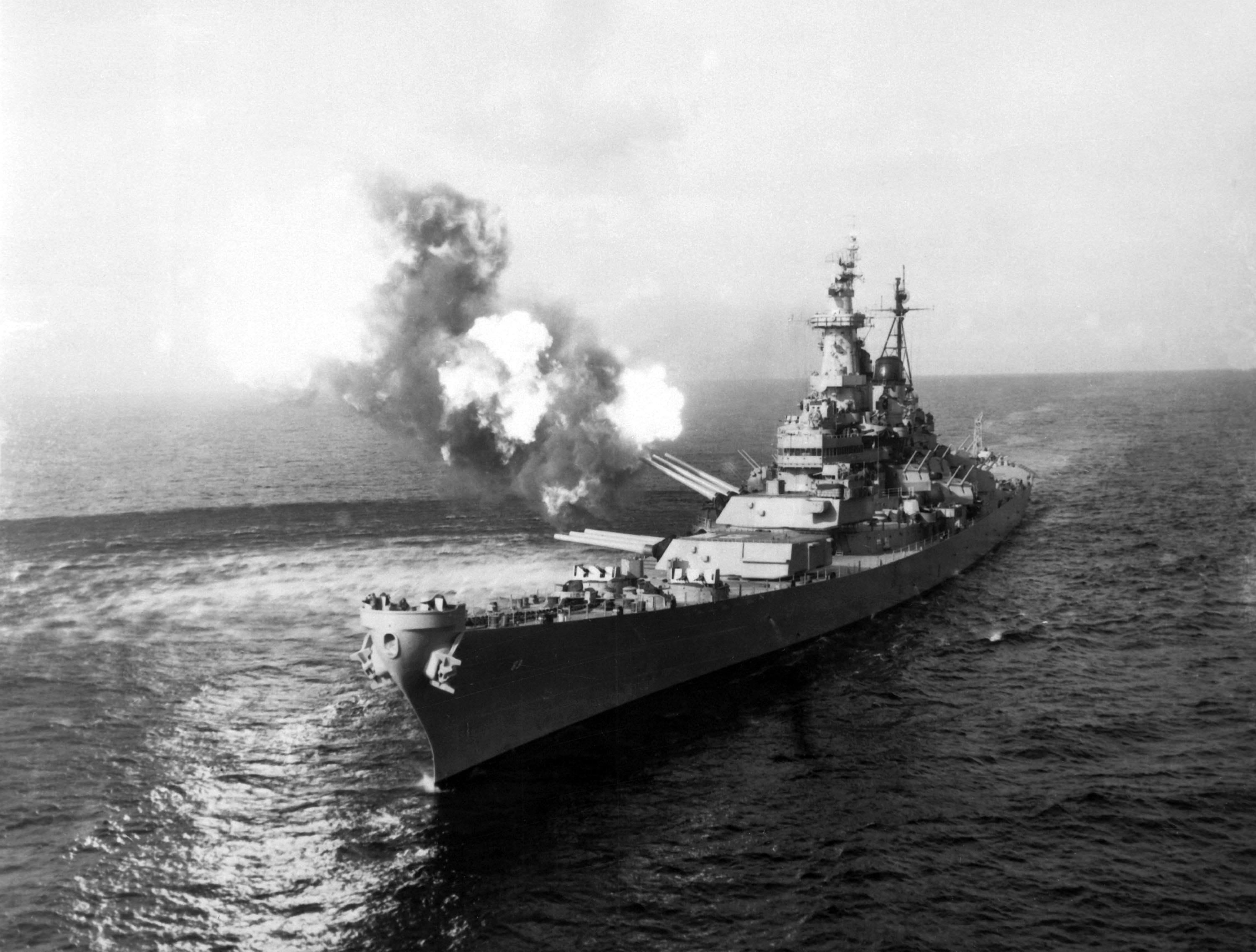 USS Missouri fires a salvo from its 16 inch guns at shore targets during Korean War 2k