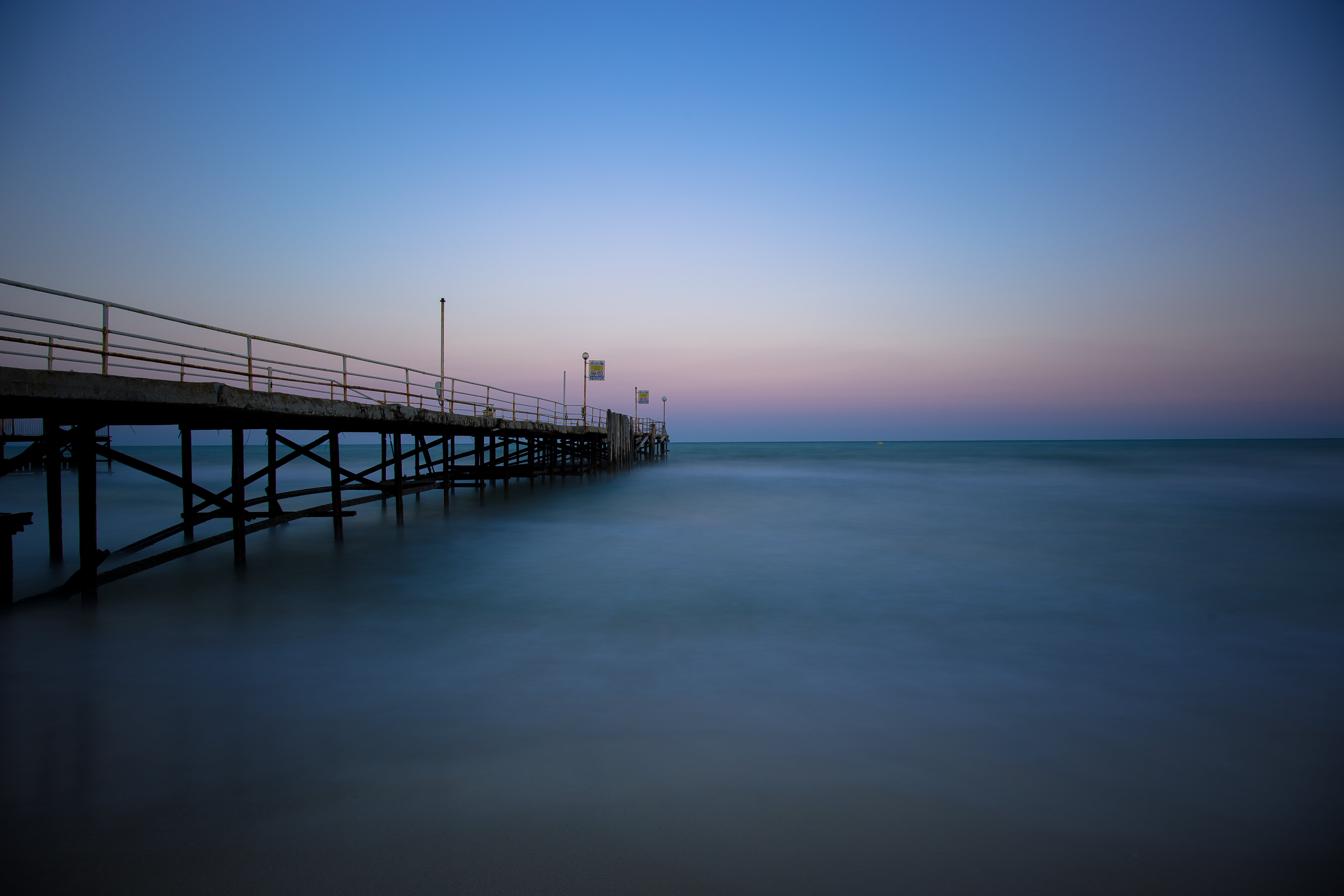 bridge surrounded by body of water under blue sky bulgaria 2k 4k 5k