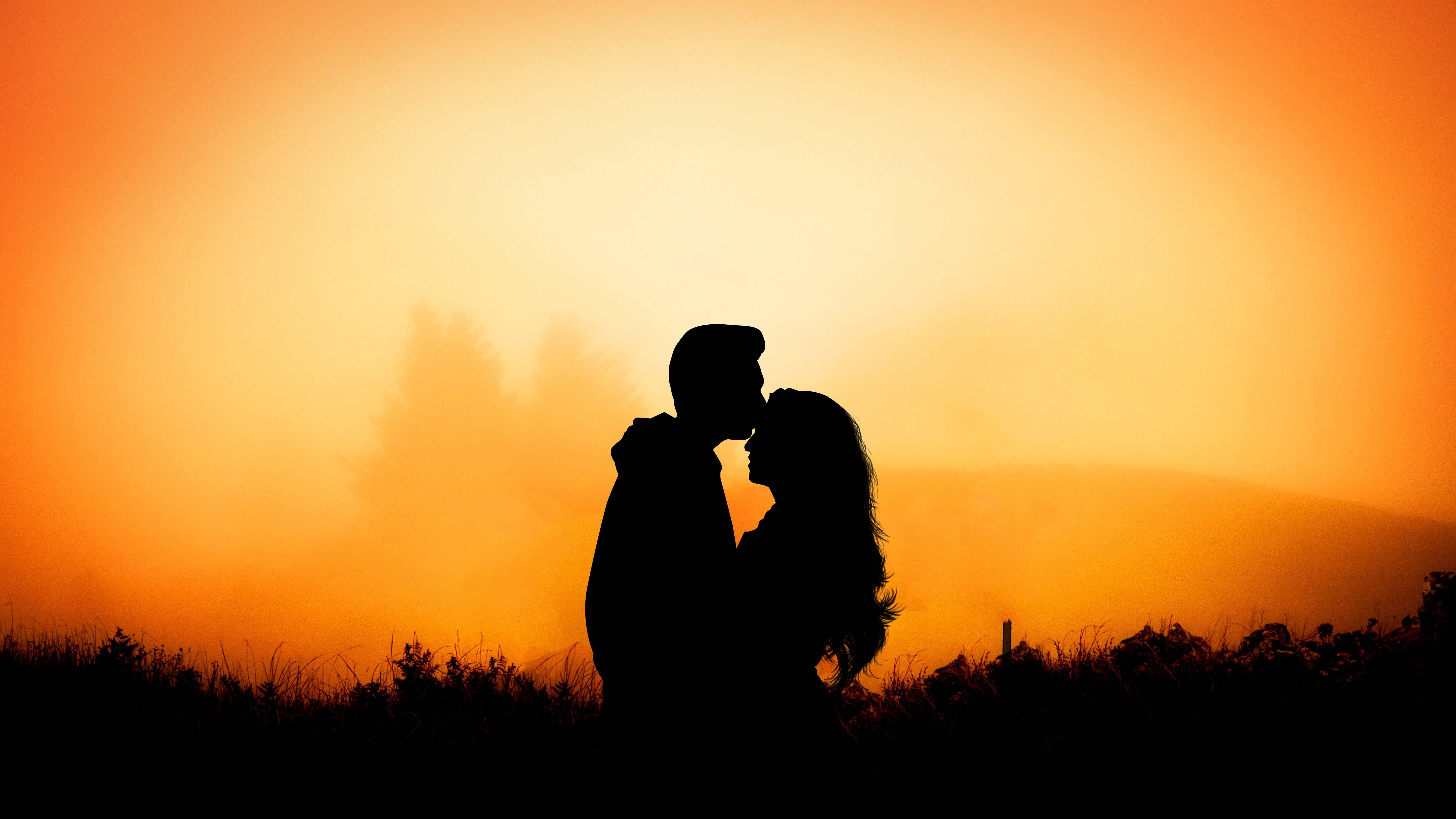 silhouette of man kissing on woman forehead sunset dawn dusk 2k 4k 5k