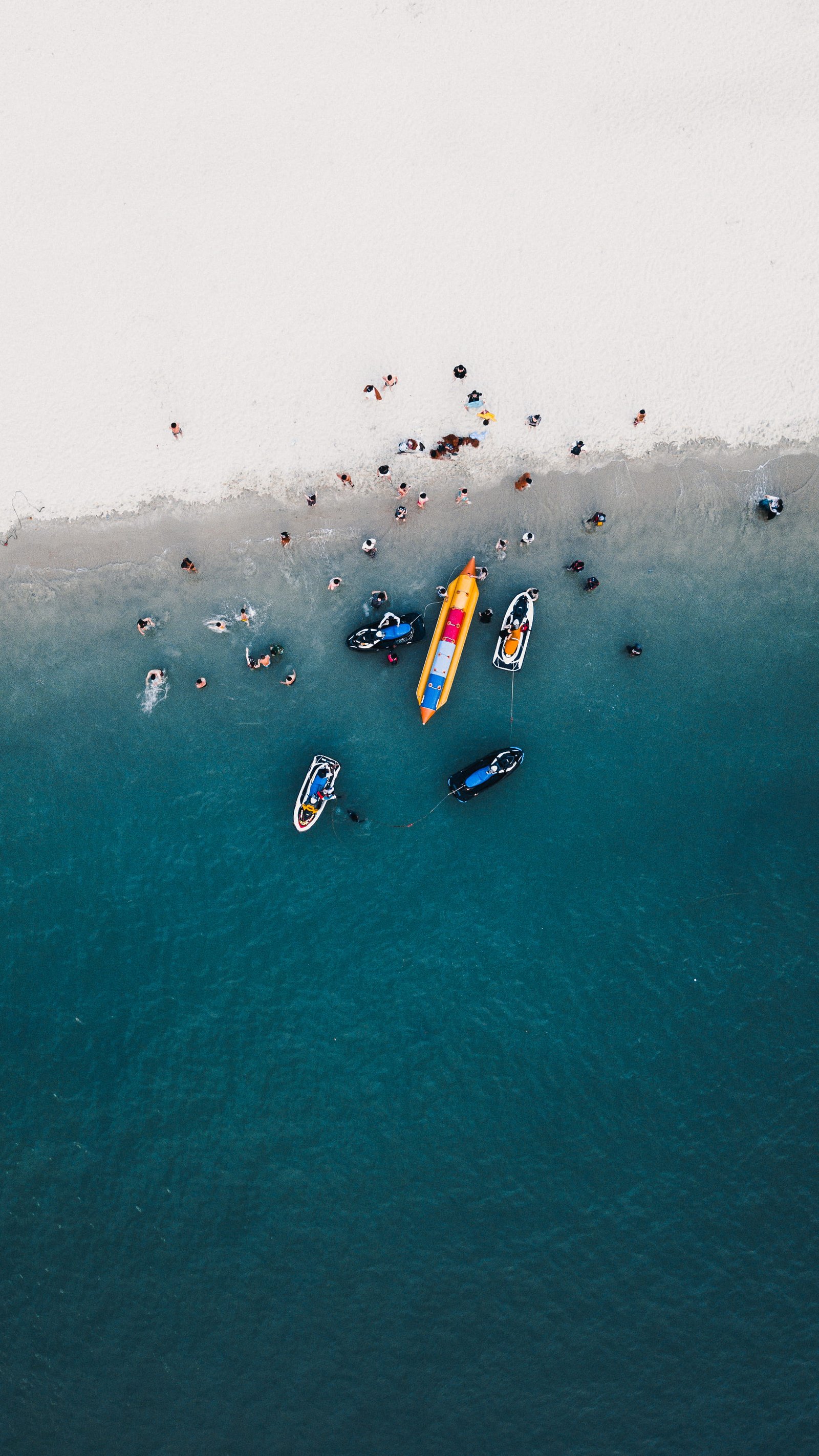 aerial photography of boats on seashore view with group people body water 2k