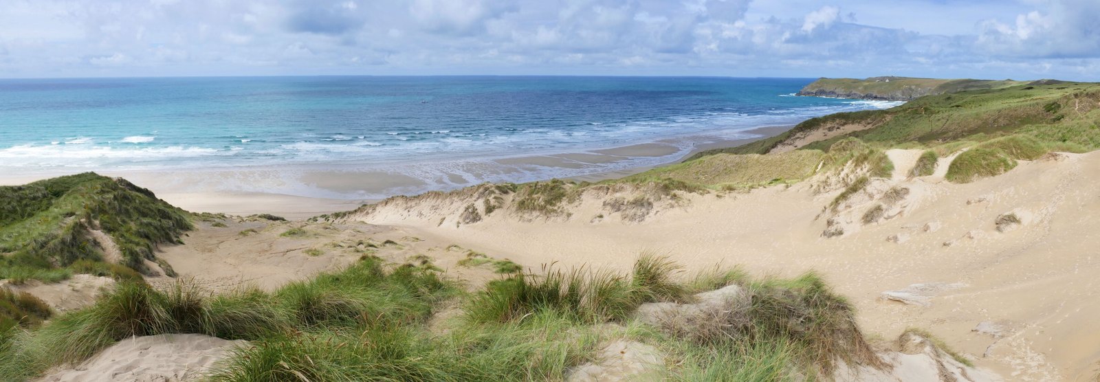 beach near the mountain under cumulus nimbus clouds penhale sands 2k 4k 5k