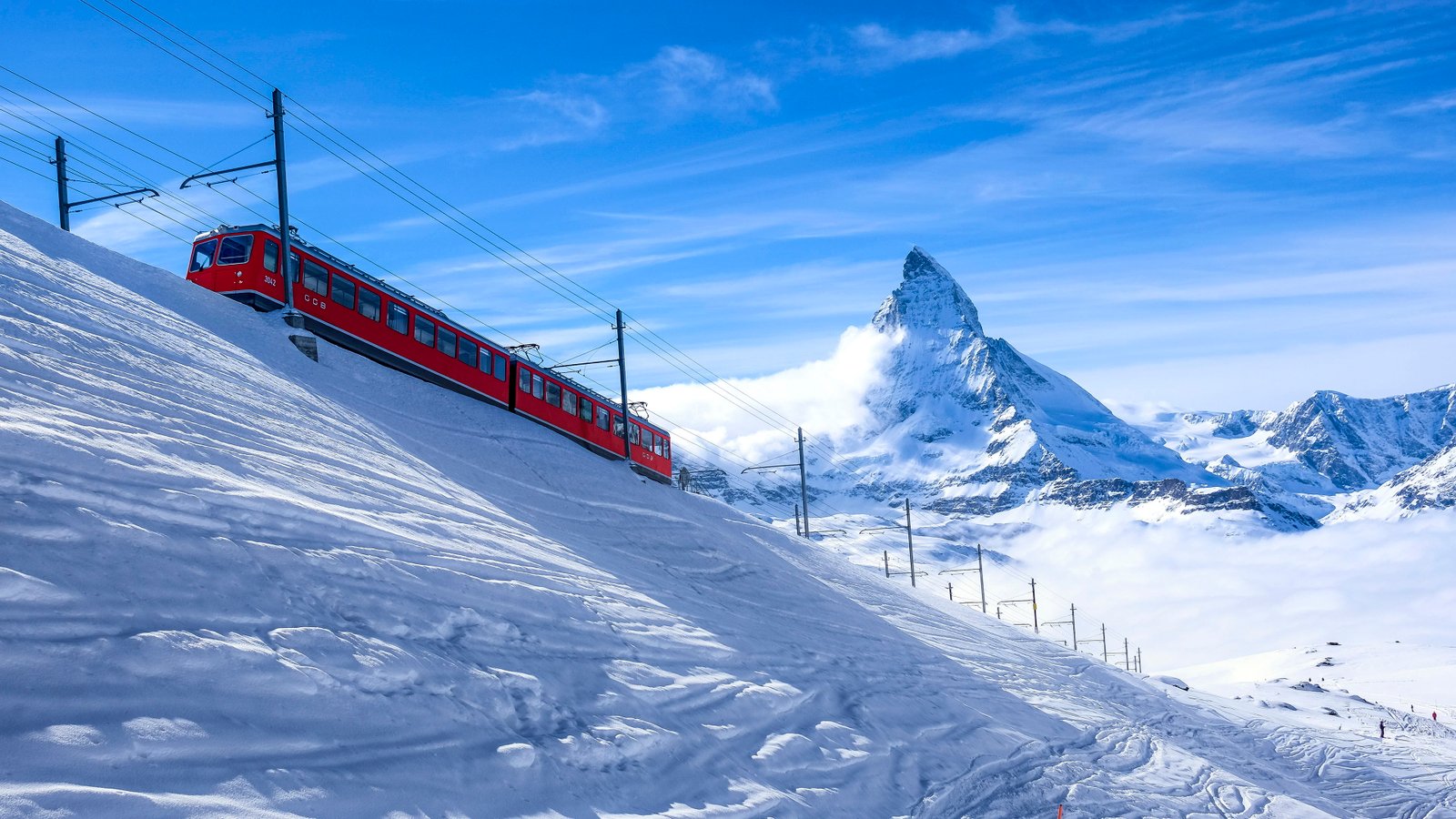 red and black train white mountains at daytime 2k 4k