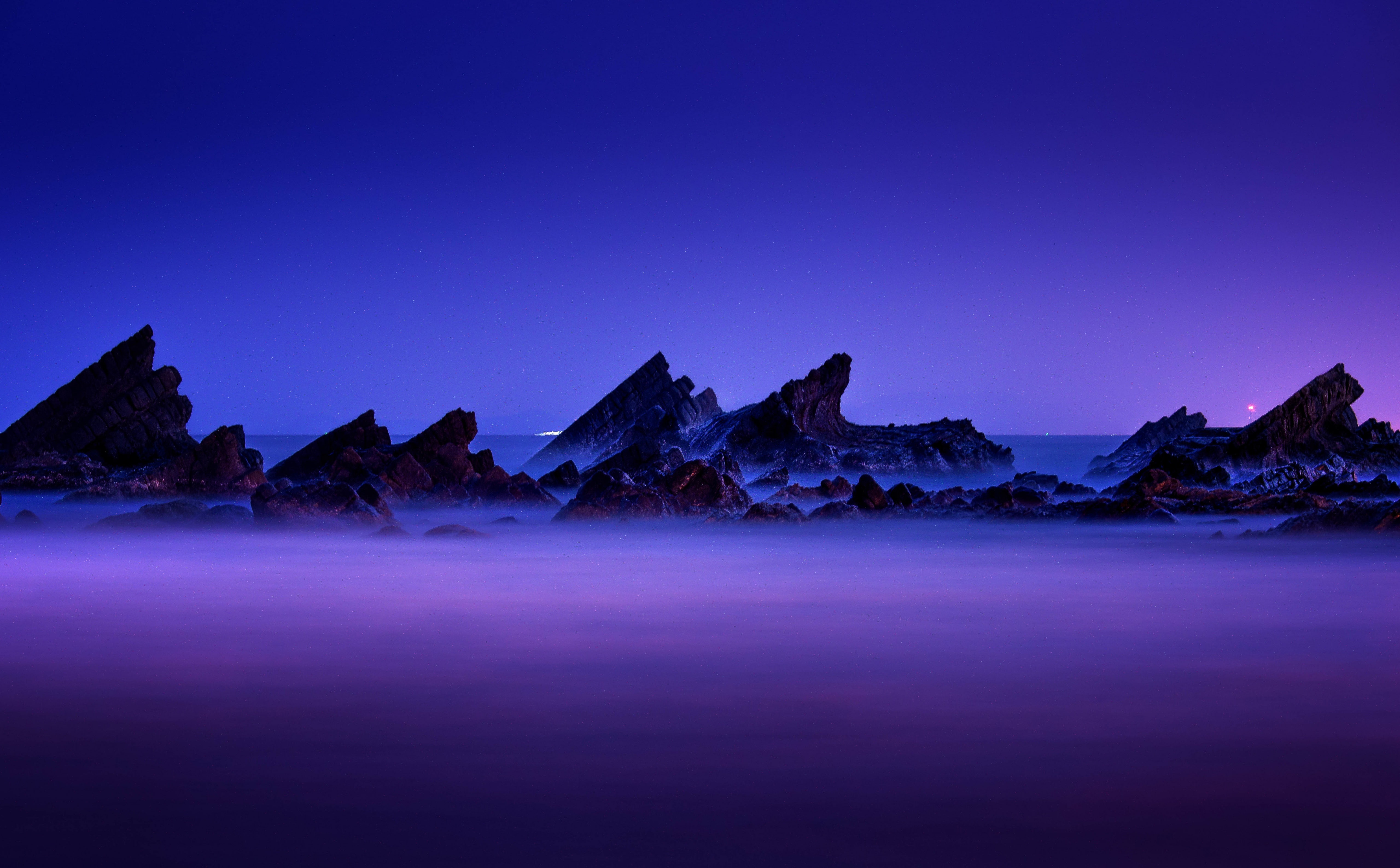 Rocks Layers Sea Mist rock formation during night wallpaper 2k 4k 5k