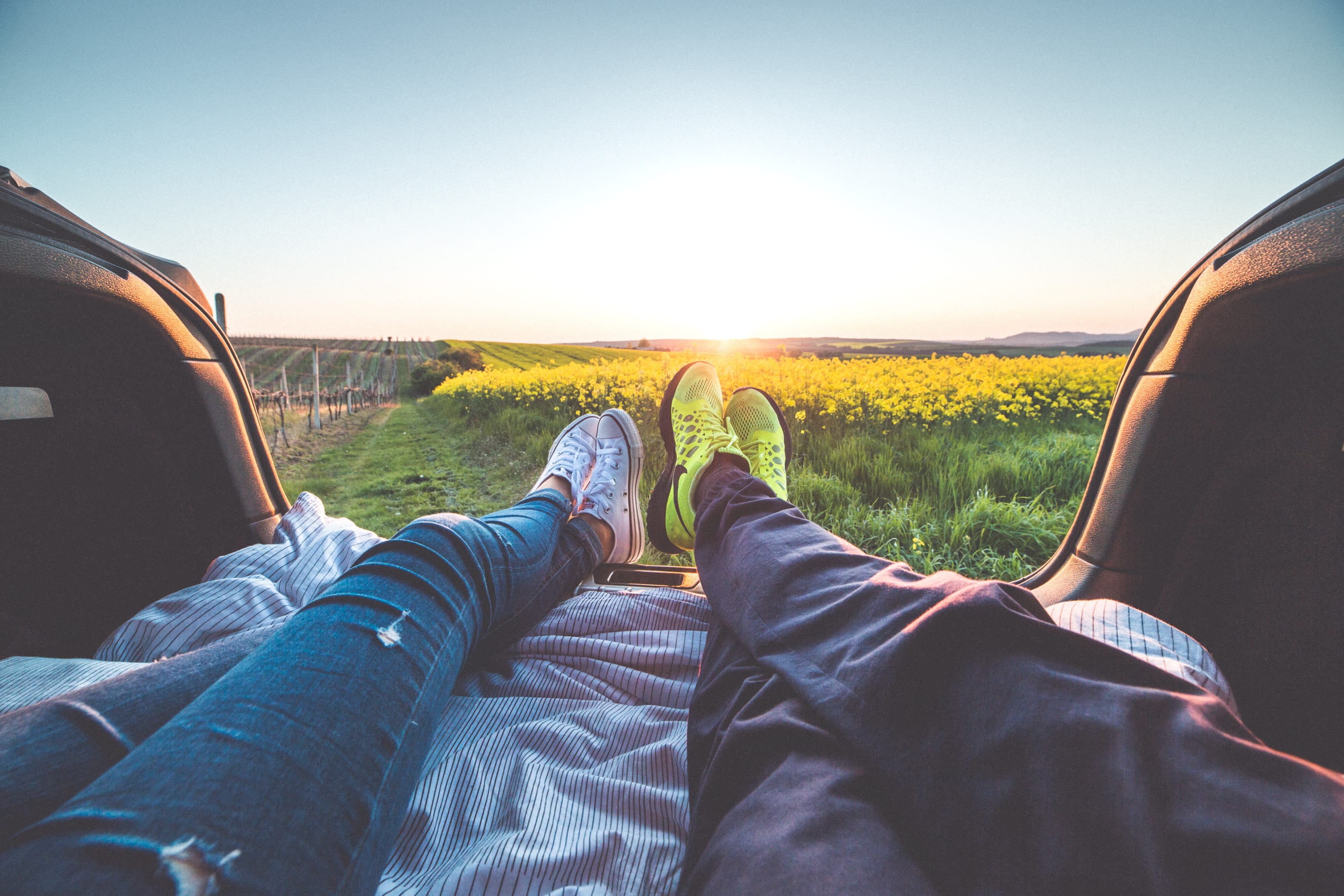 Young Couple Enjoying Romantic Sunset from Car Trunk booth boy 2k 4k