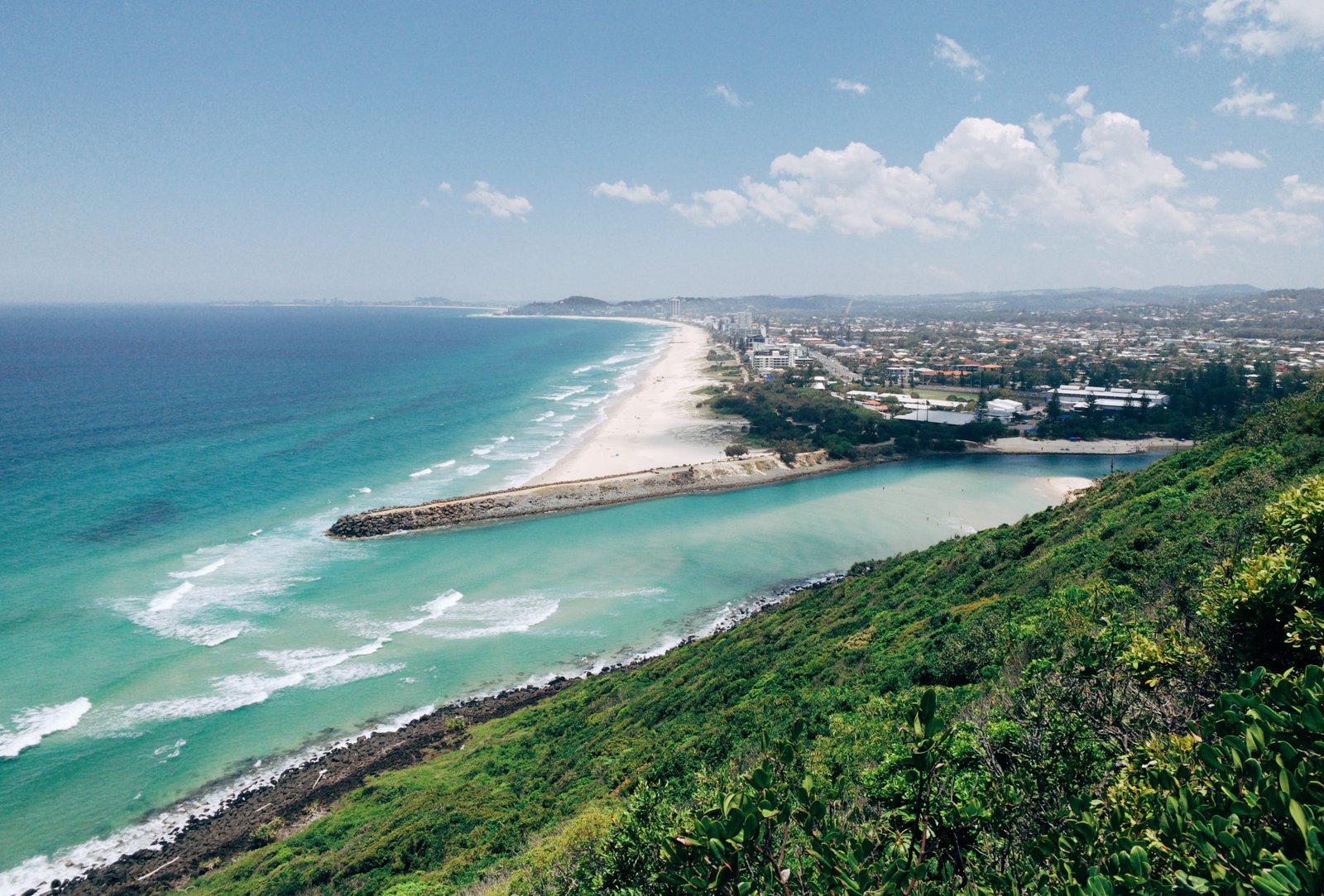 beach near city water outdoors nature sea ocean land shoreline 2k 4k
