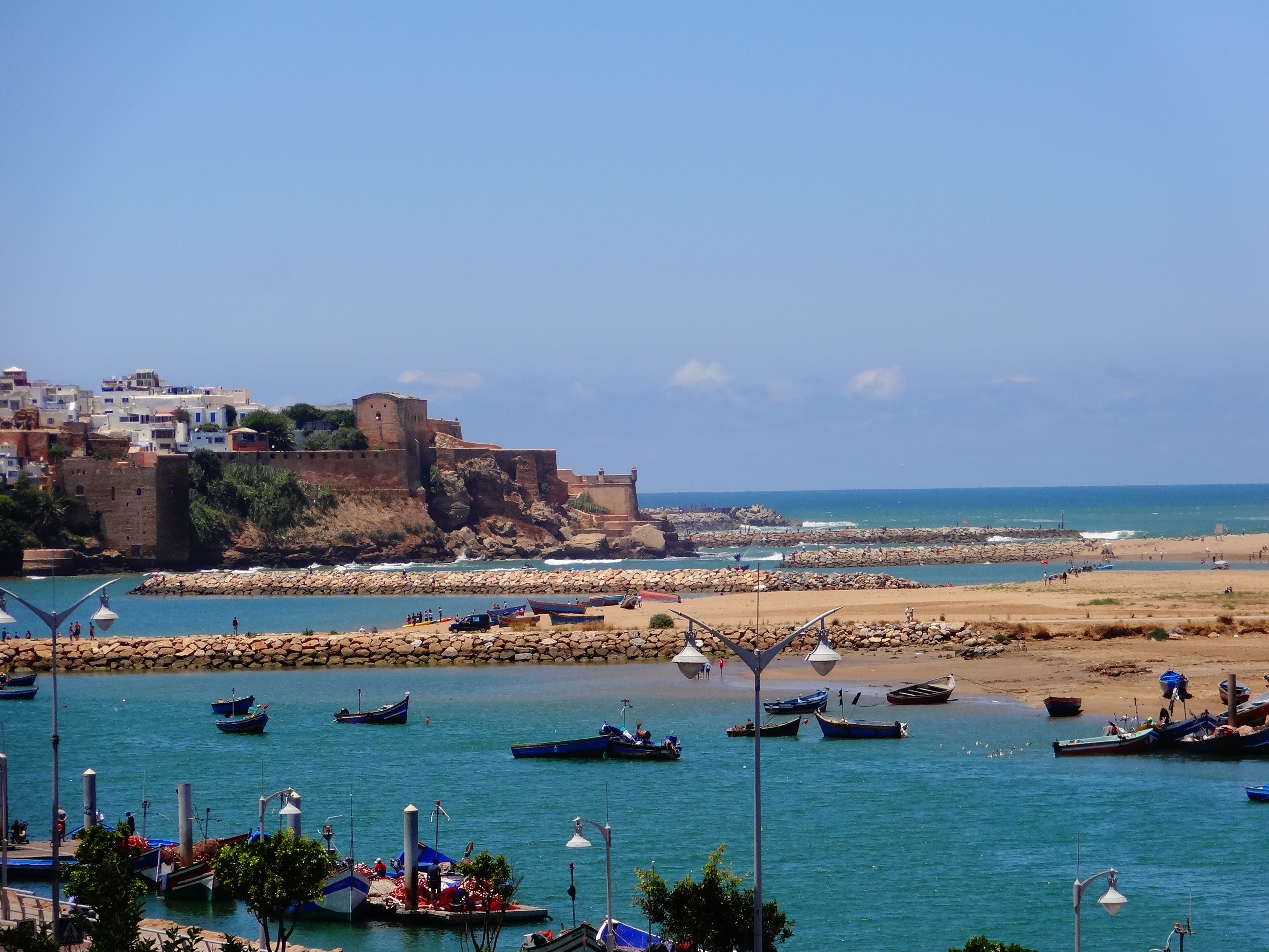 boats on body of water under blue sky during daytime morocco 2k