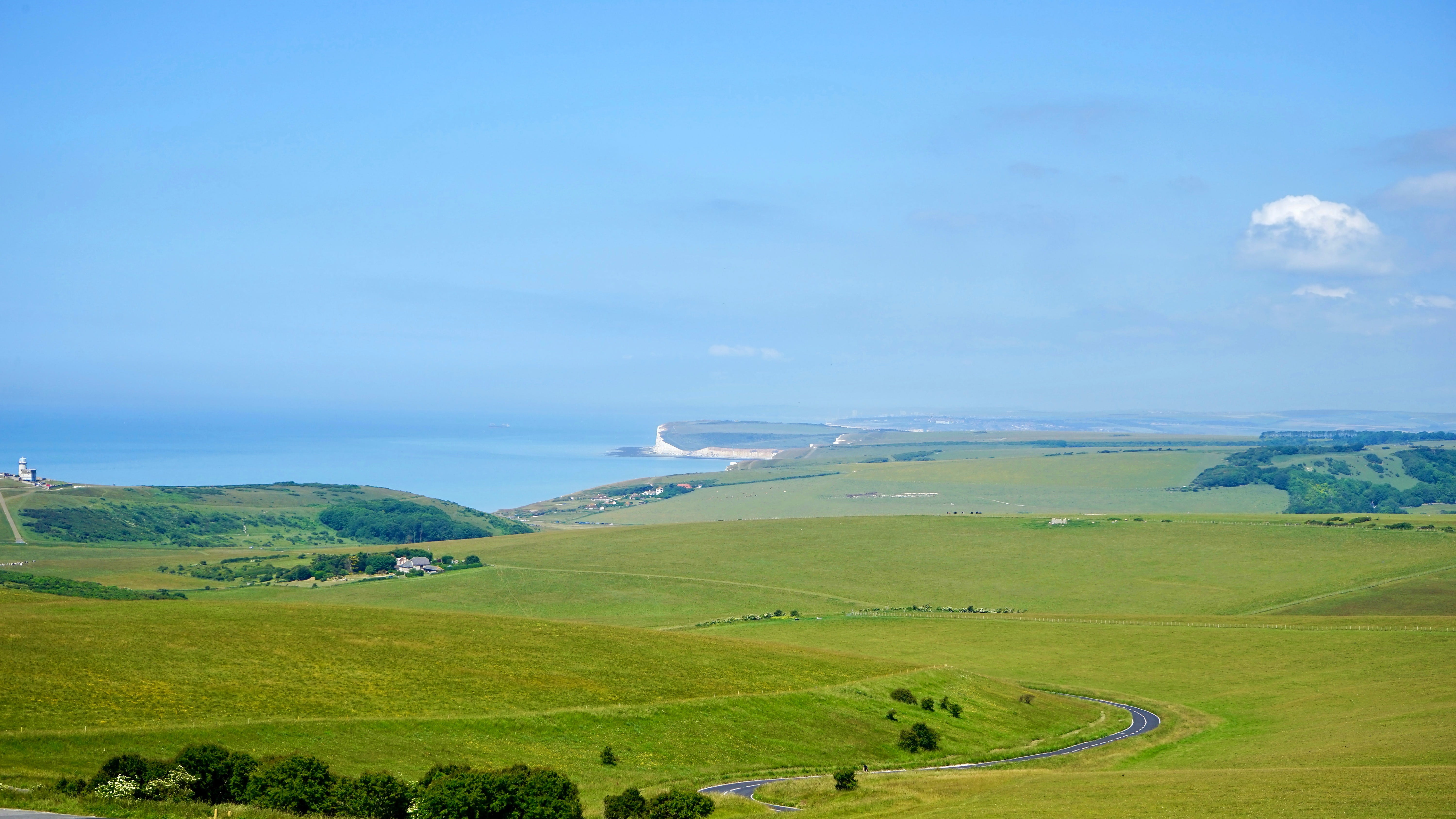 green grass field under blue sky at daytime Landscape Countryside 2k 4k 5k