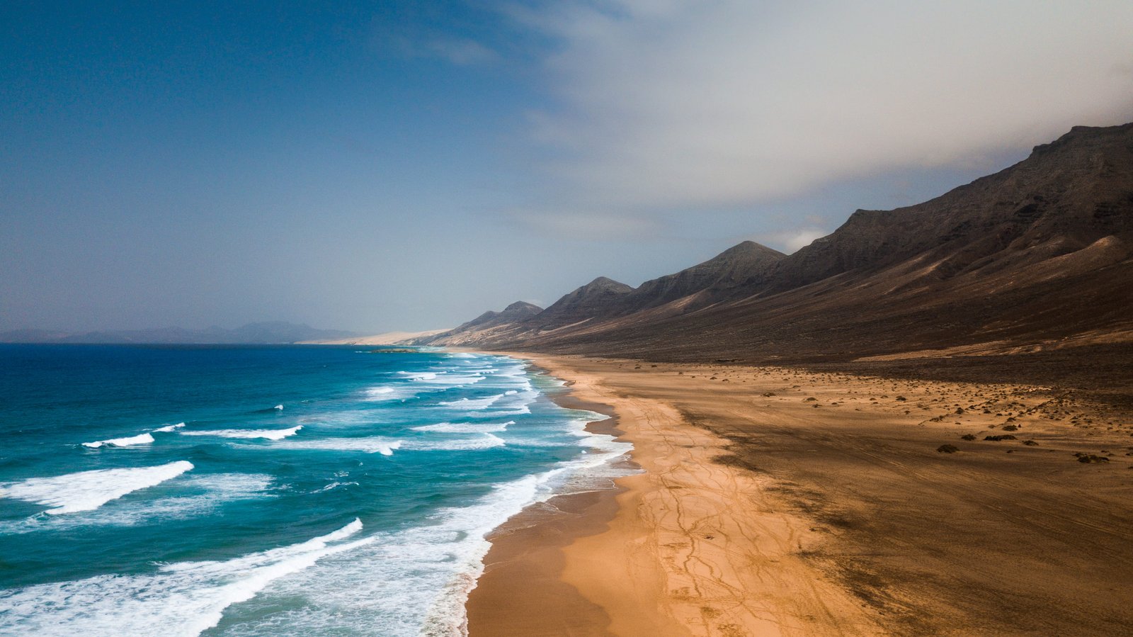 mountain beside sea at daytime nature outdoors water ocean 2k 4k