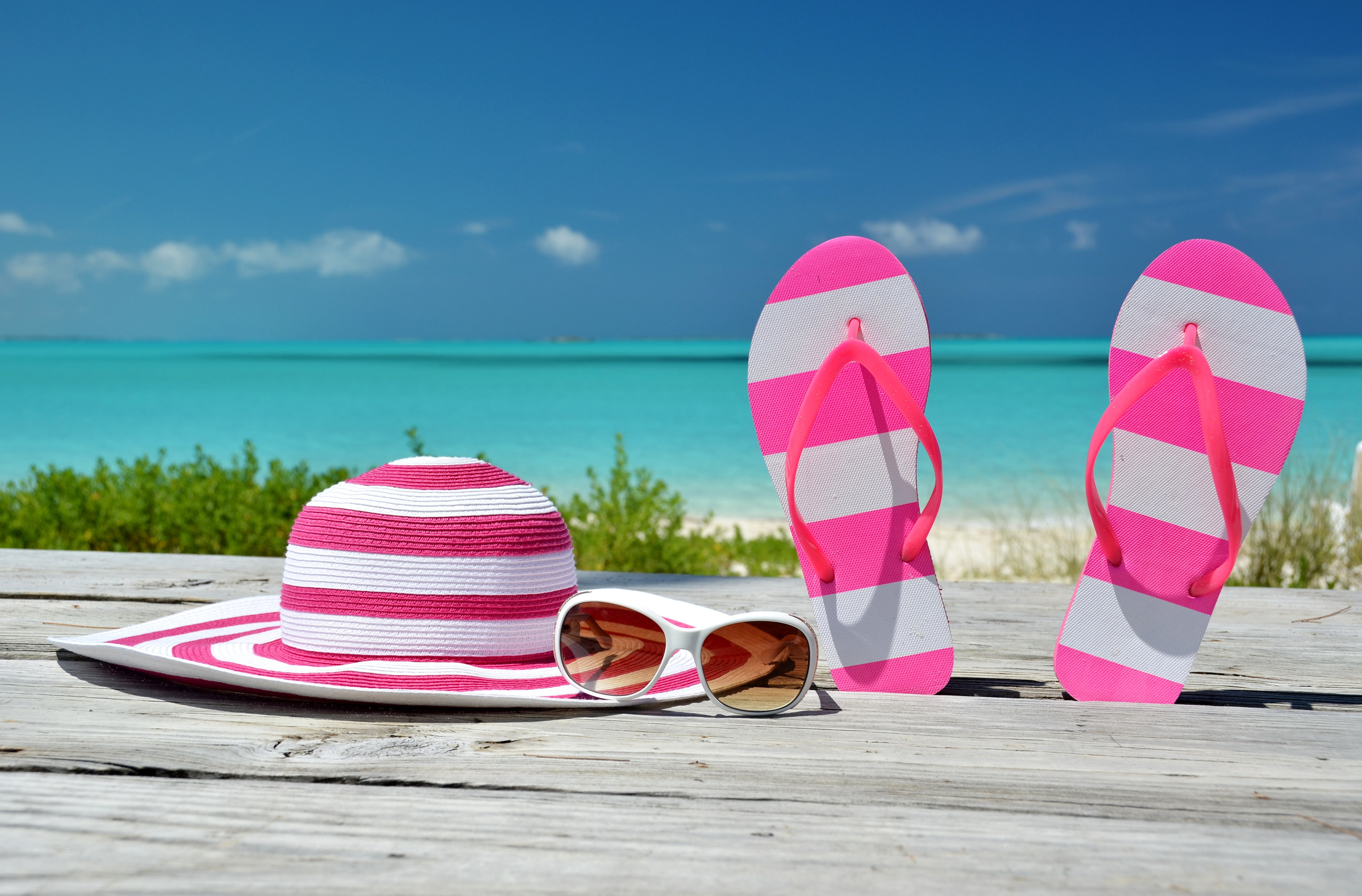 pair of pink and white striped flip flops sun hat sea beach 2k 4k 5k