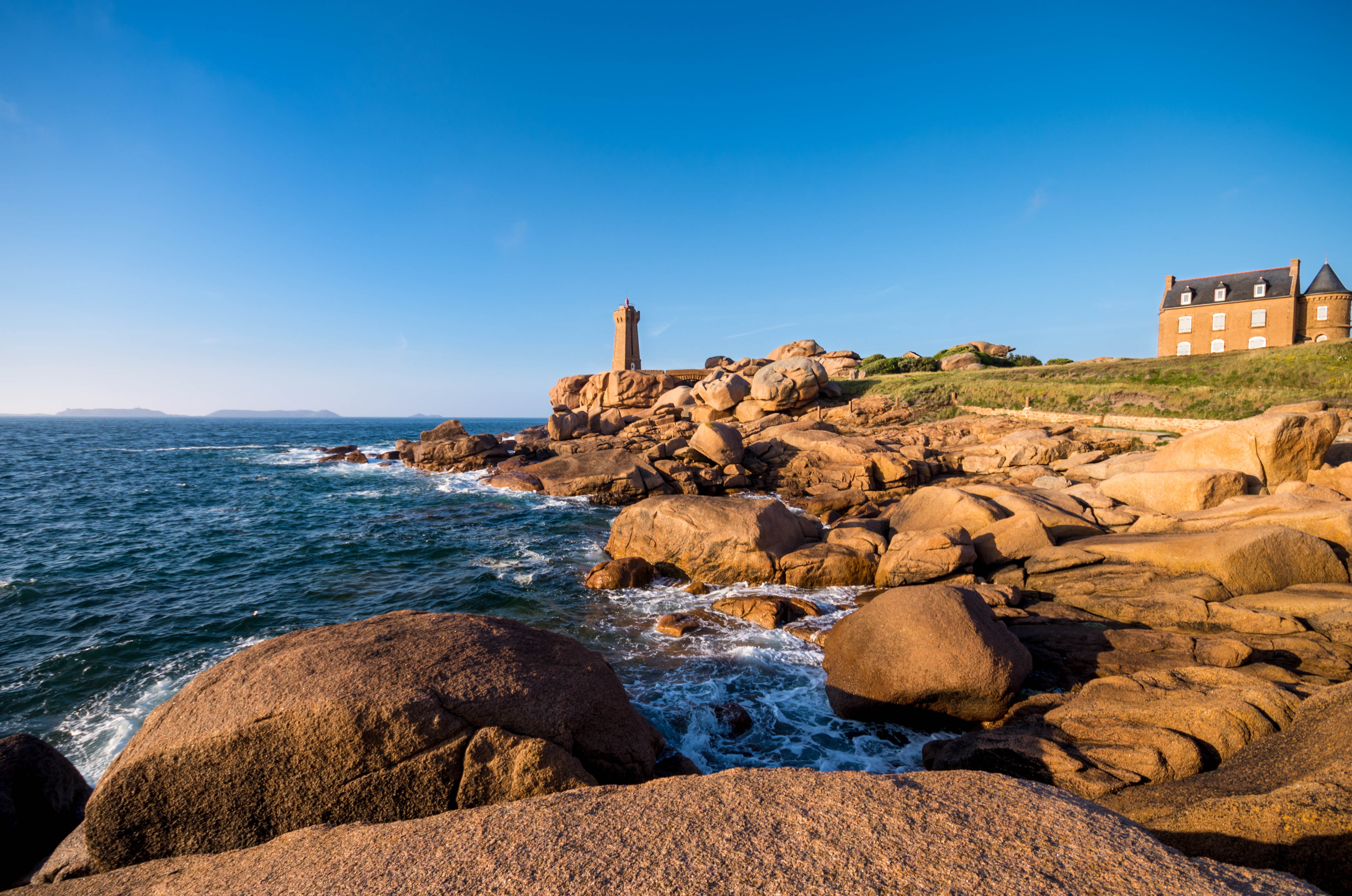 brown concrete tower near cliff Phare de Mean Ruz Ploumanac h 2k 4k 5k
