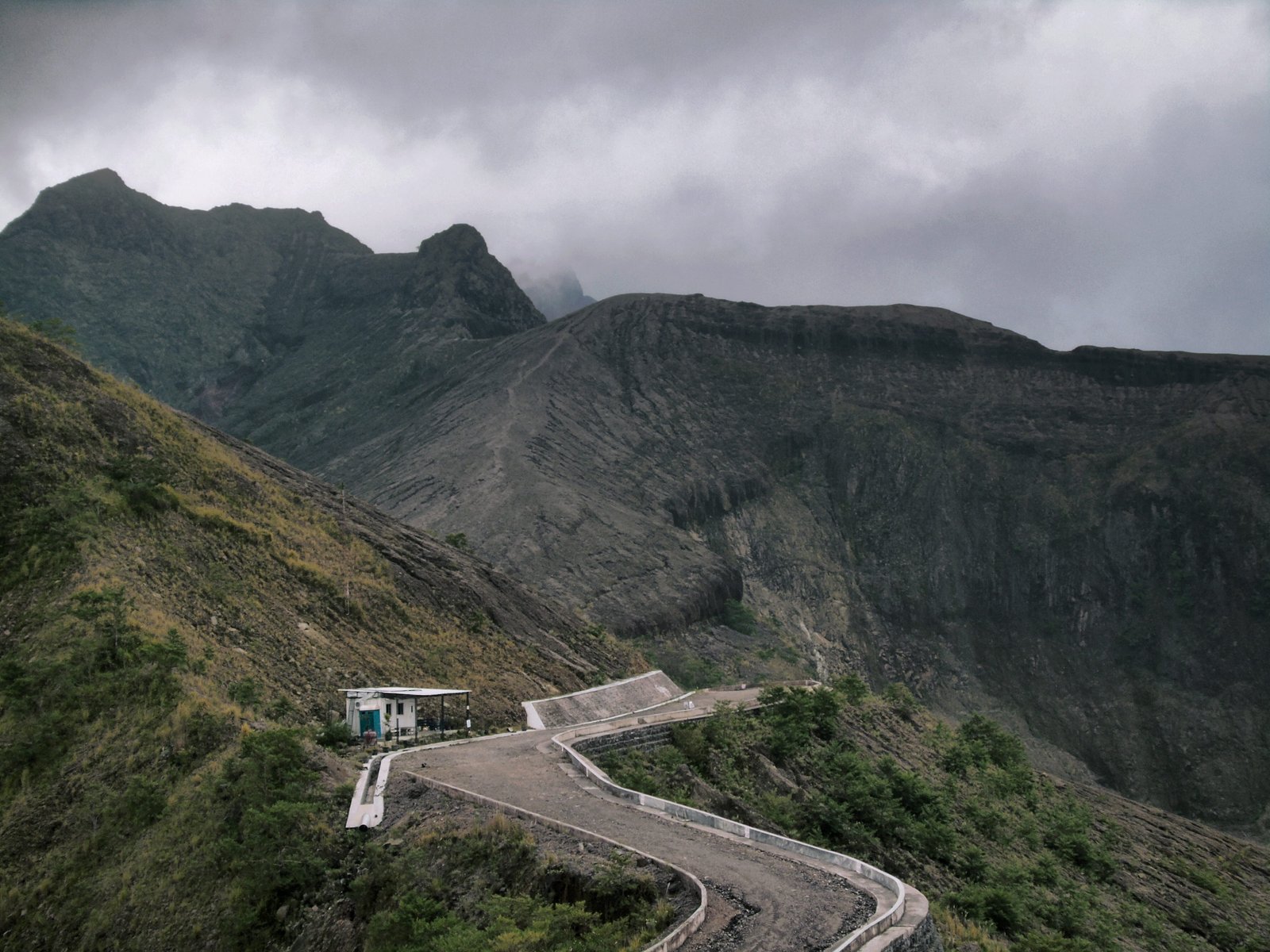 white painted house on mountain under cloudy sky indonesia road 2k 4k 5k