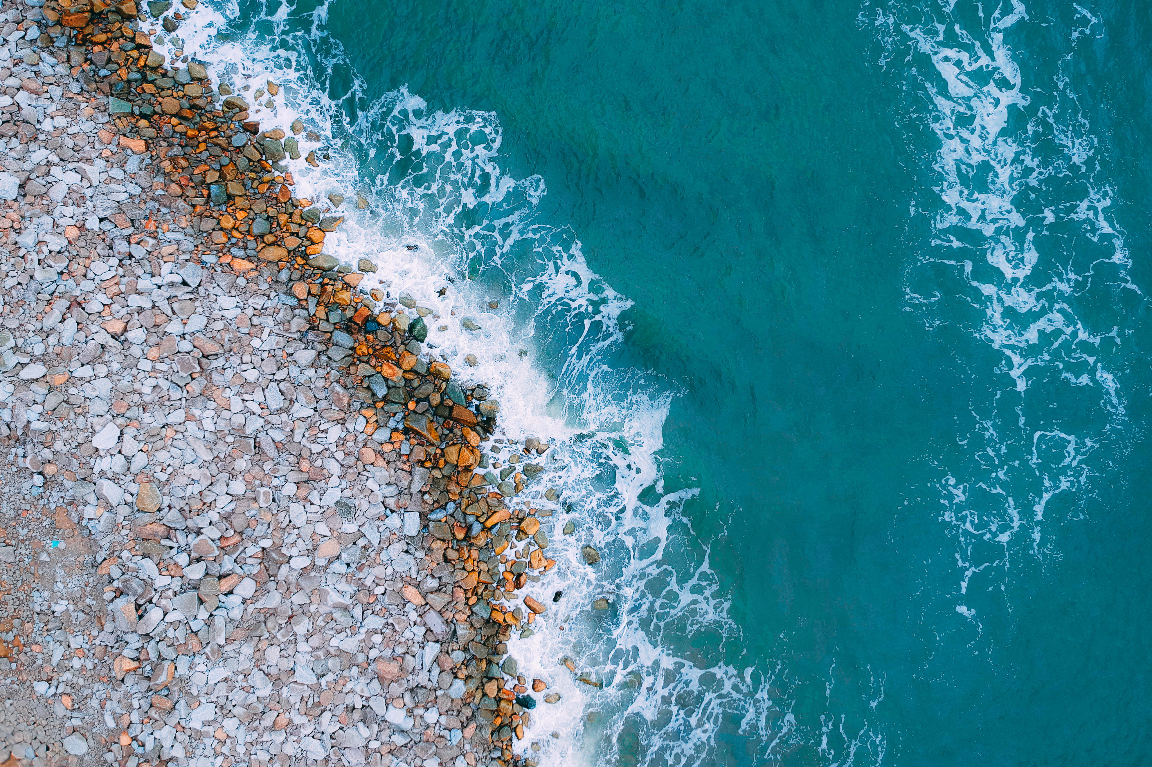 Aerial View Photography of Rocky Shore bird s eye view coast 2k 4k