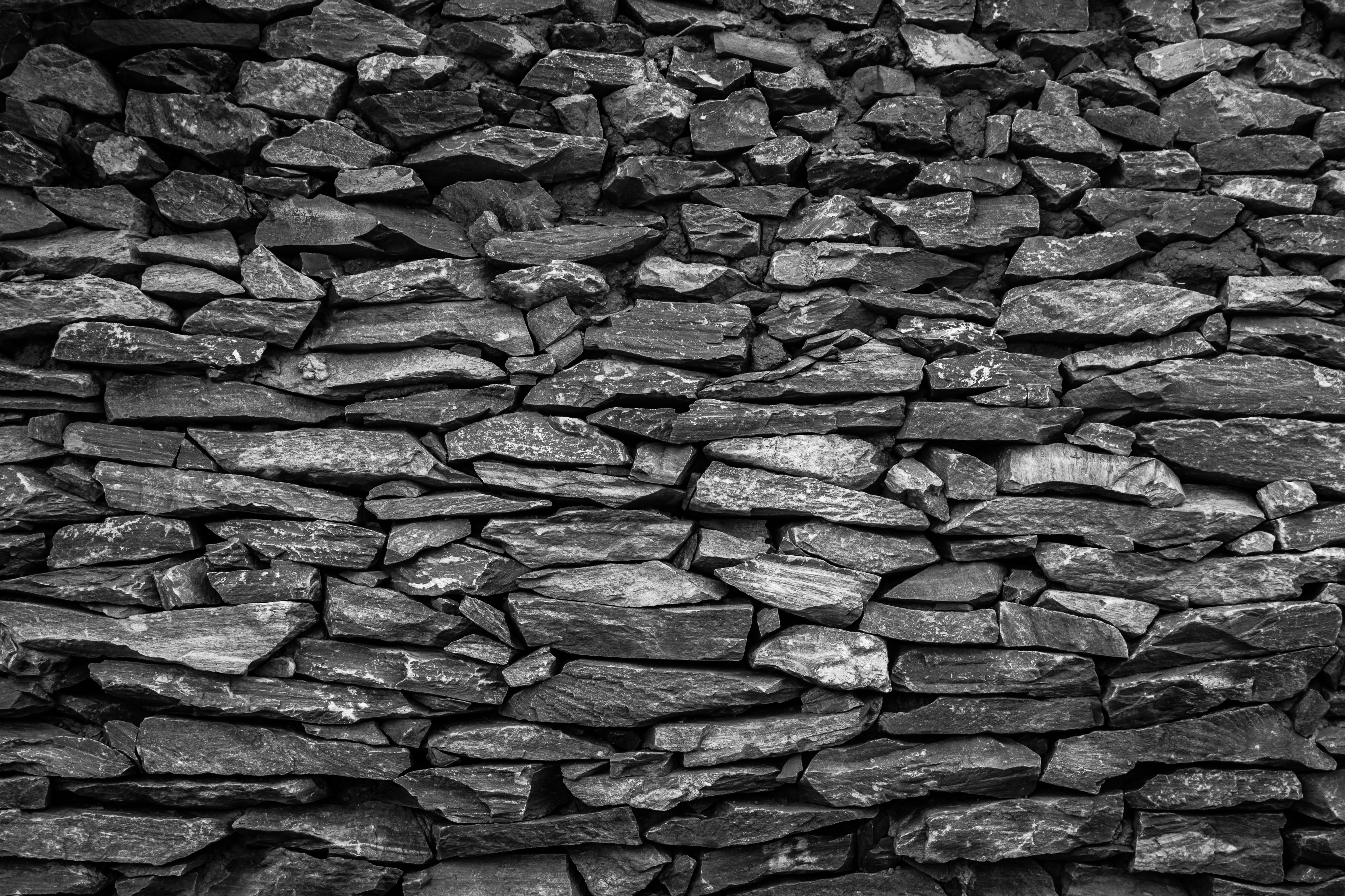 black stone fragment lot Wall Texture Brick Rock background 2k 4k 5k