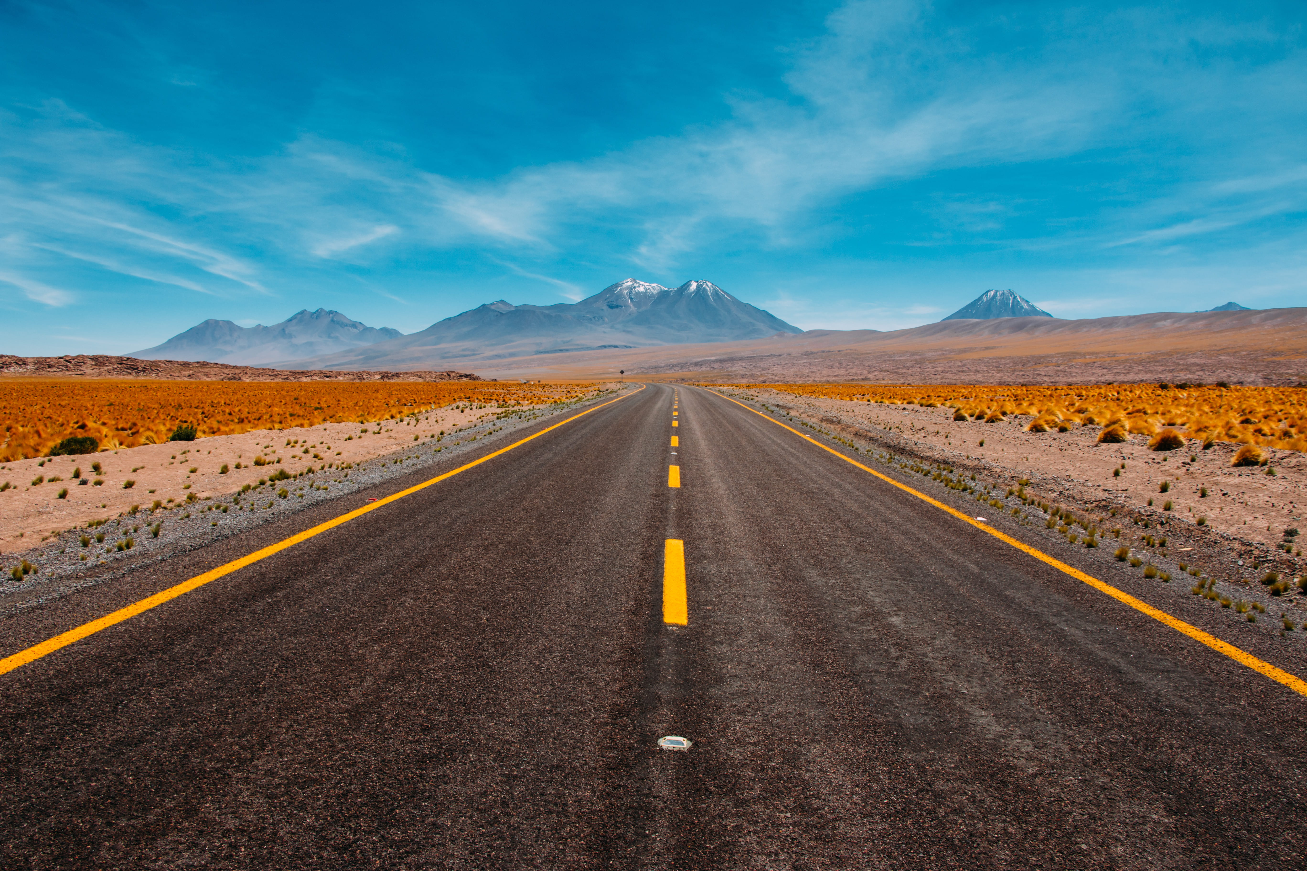 lone road going to mountains empty desert wallpaper middle 2k 4k 5k