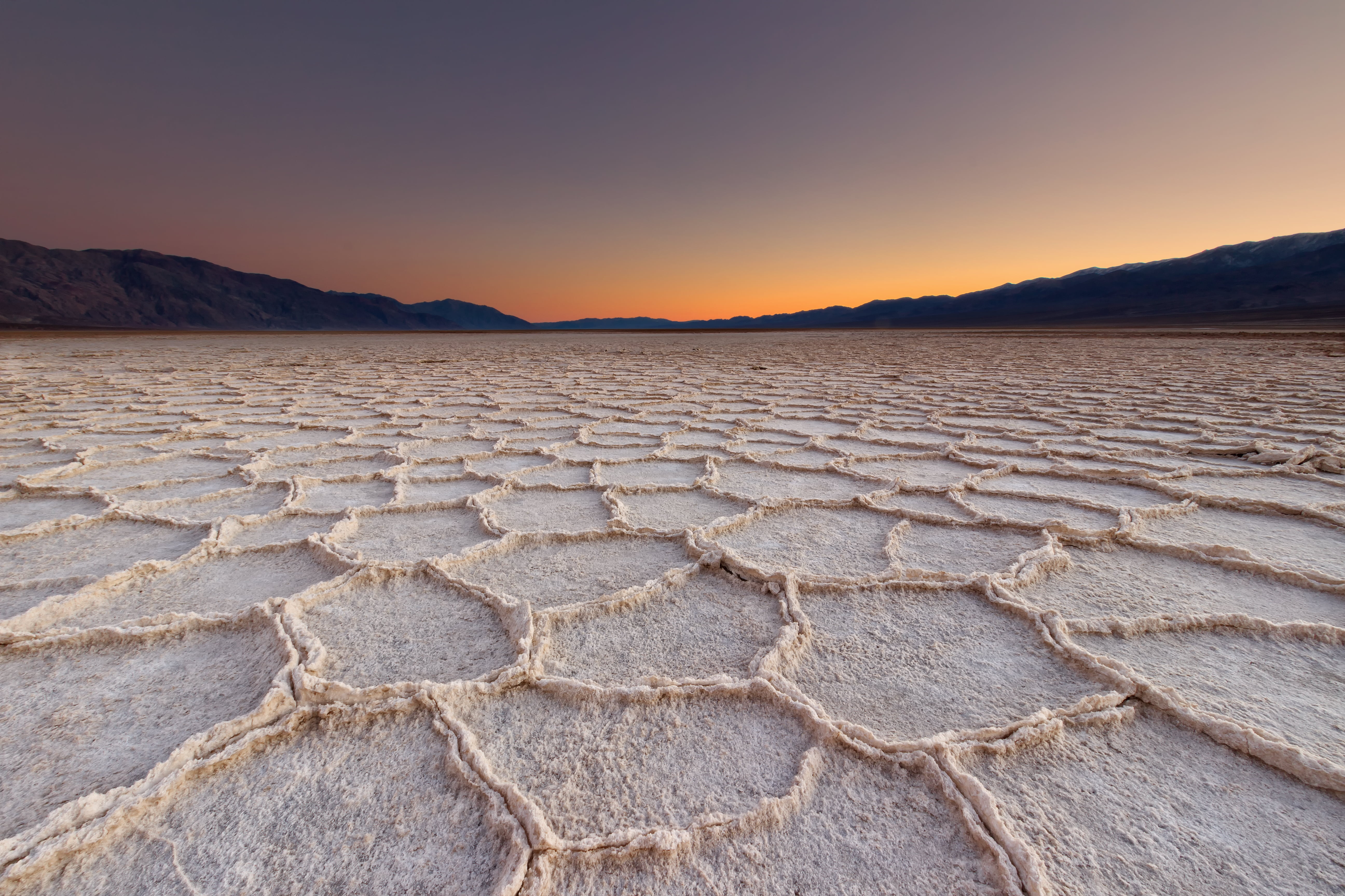 photo of dried ground during golden hour badwater basin death valley national park 2k 4k 5k