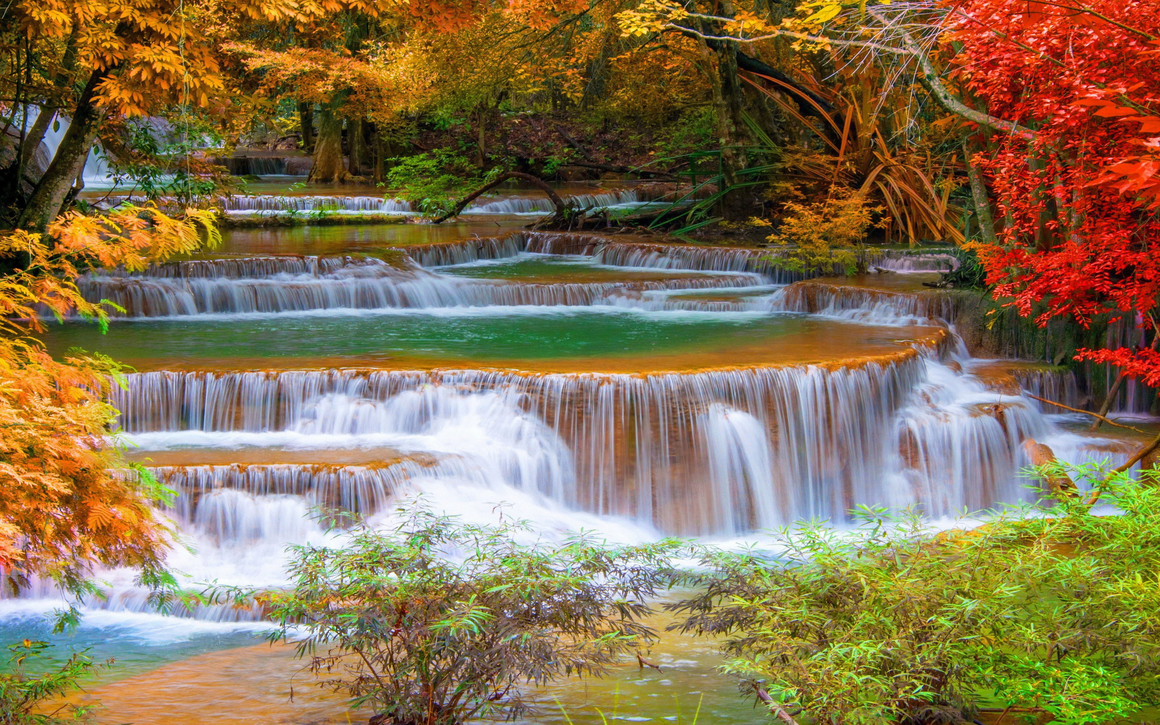 Thailand Kanchanaburi cascade waterfall in autumn trees with red and yellow leaves Desktop HD Wallpapers for mobile phones computer 2k 4k