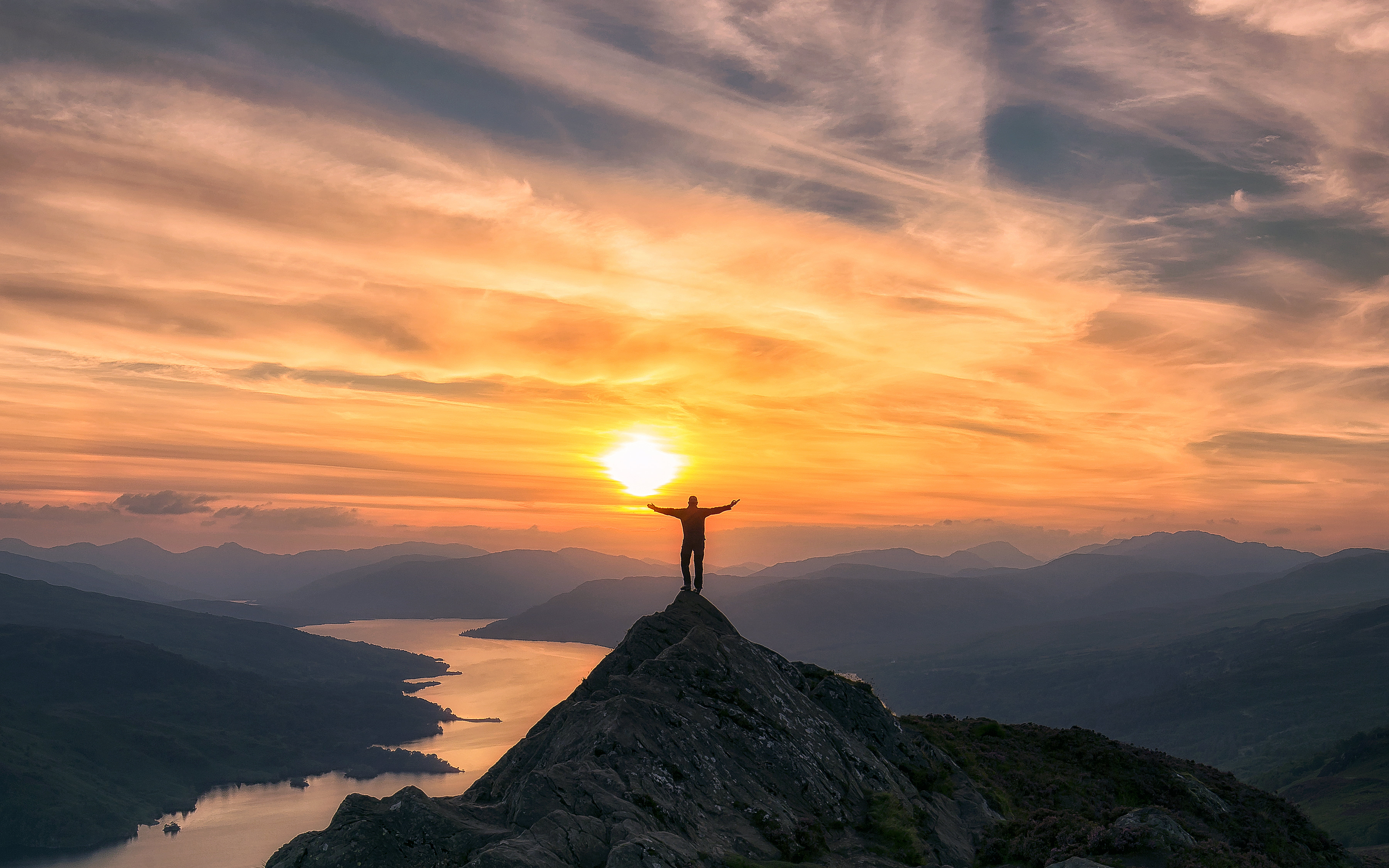 photo of man on top mountain during sunset Trossachs Scotland 2k 4k 5k