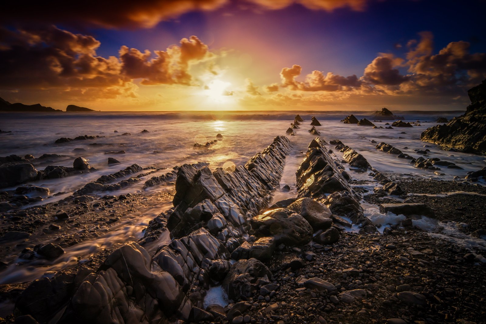 rock formation beside seashore under sunrise photography explored 2k 4k 5k