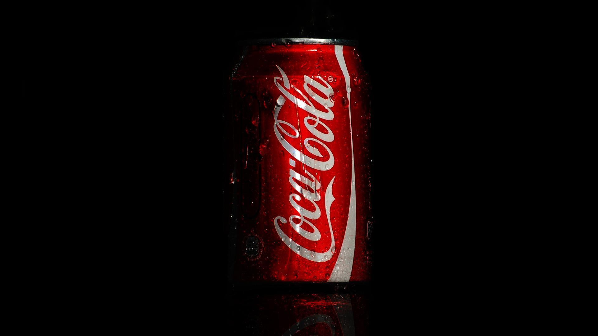 Coca Cola soda can drops macro drink brand name editorial 2k