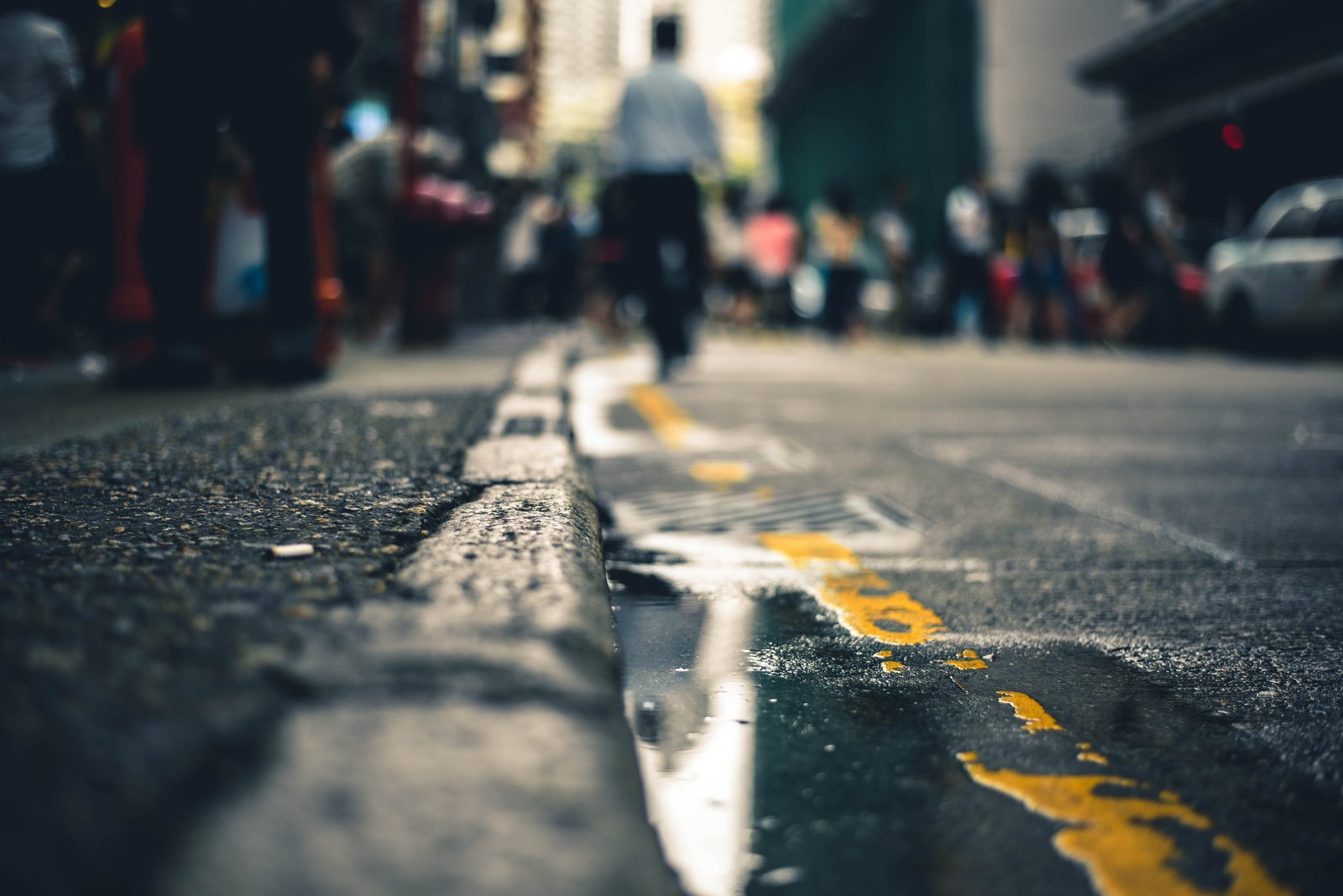 macro photography of water on road people walking street 2k 4k 5k