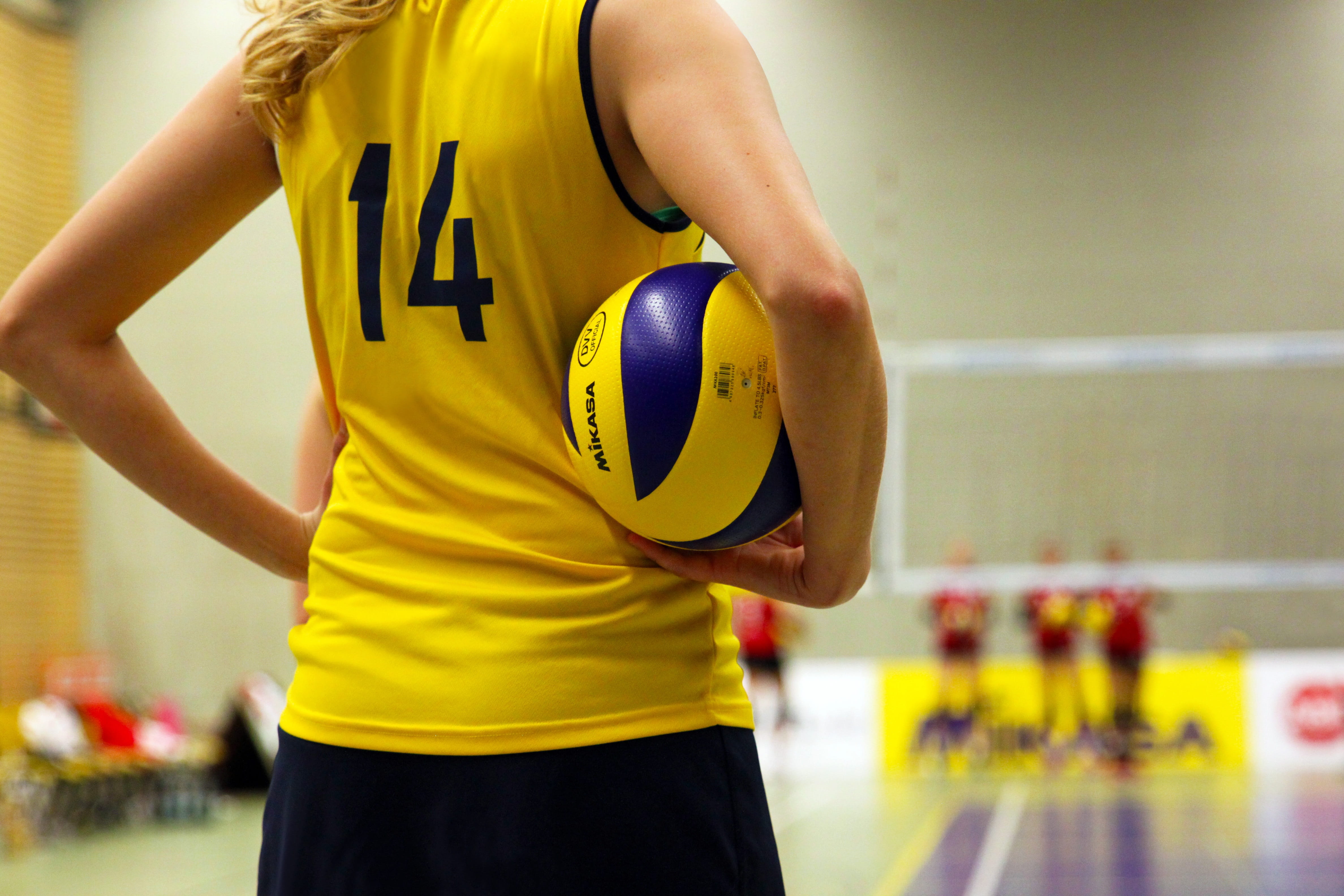 macro shot photography of volleyball player holding ball woman 2k 4k 5k