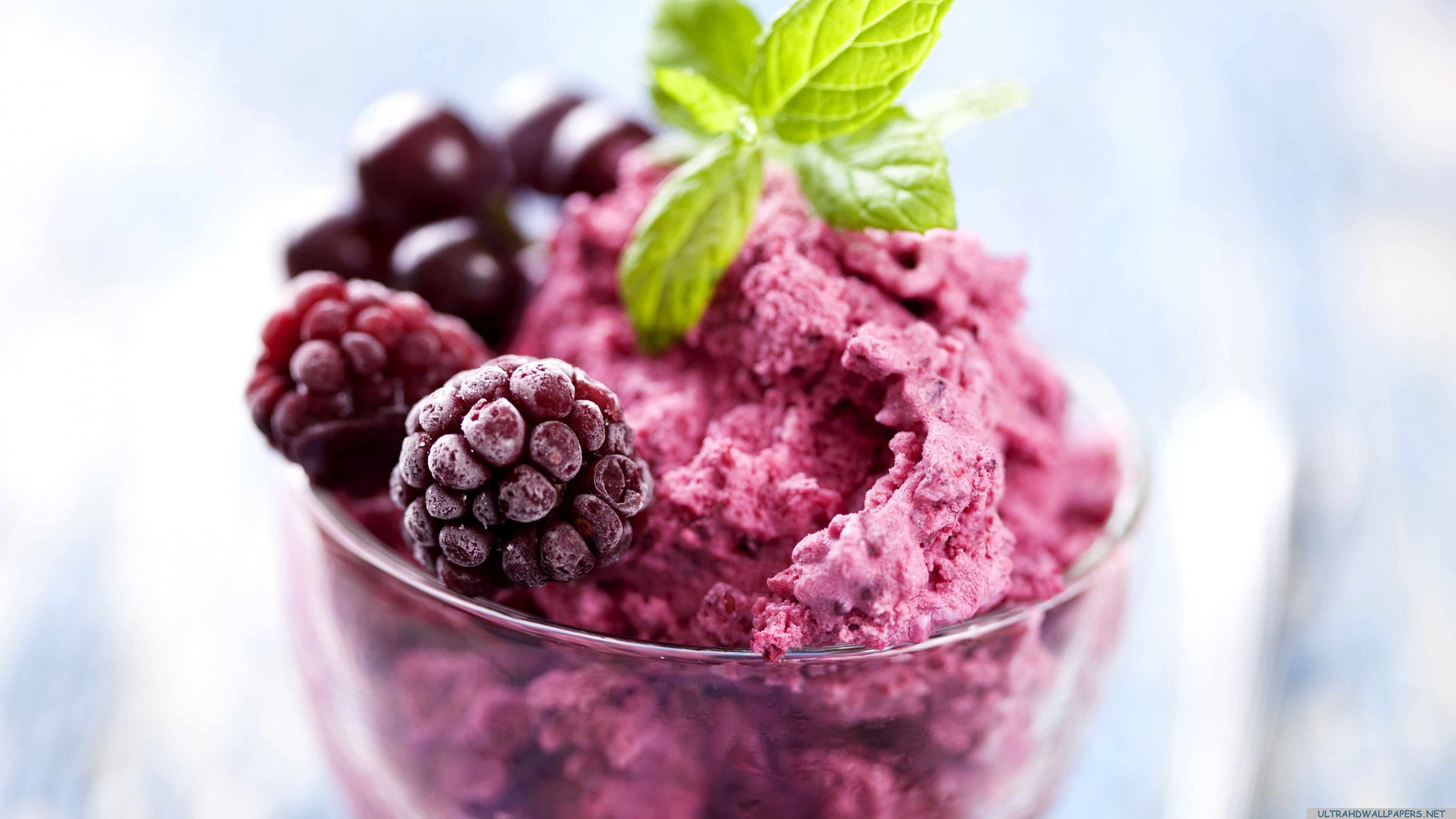 pink ice cream with fruit toppings and mint leaf shallow focus photography of raspberry 2k 4k